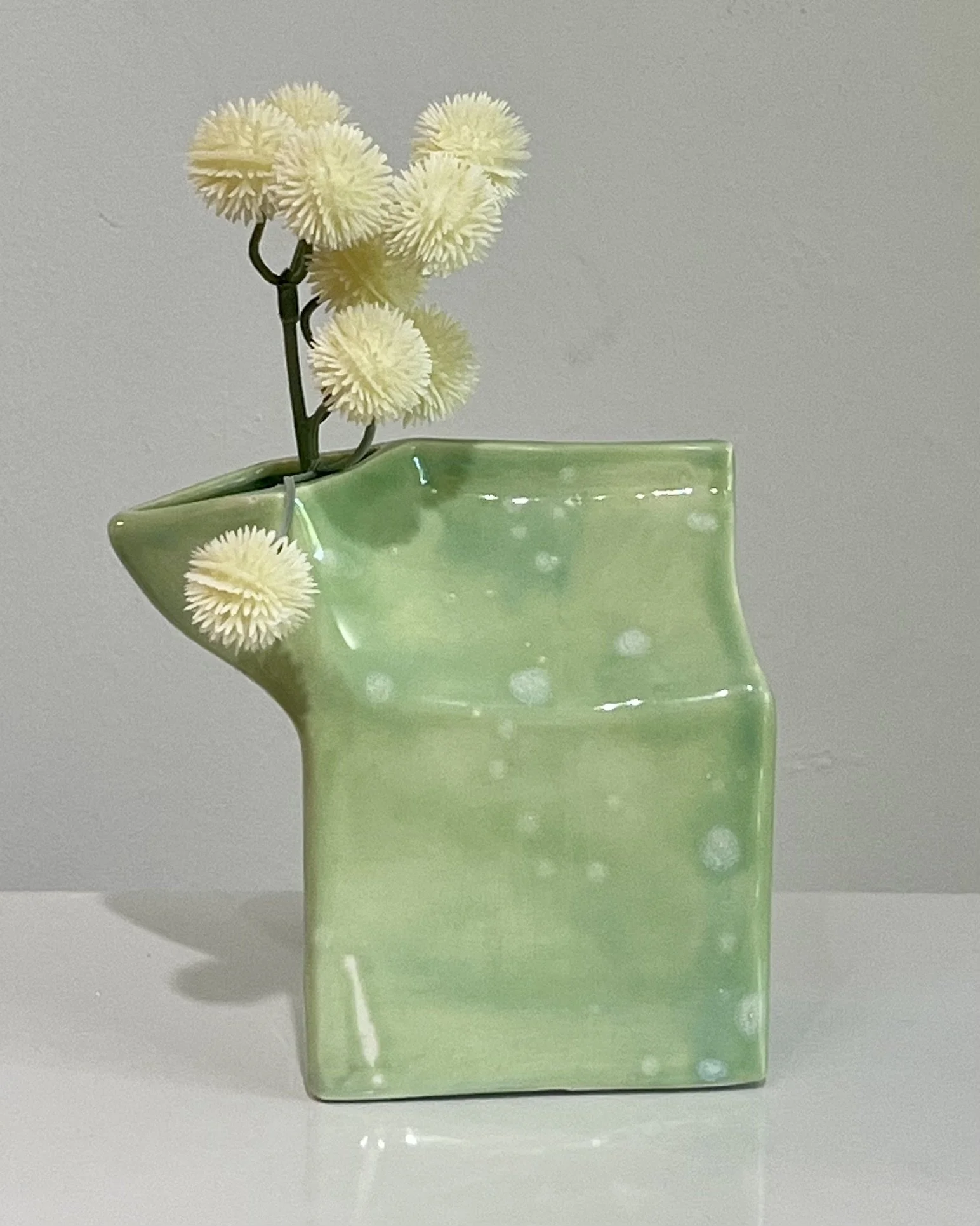 Celadon Bloom over Saguaro porcelain milk carton sculpture with flowers by Alissa Van Atta.