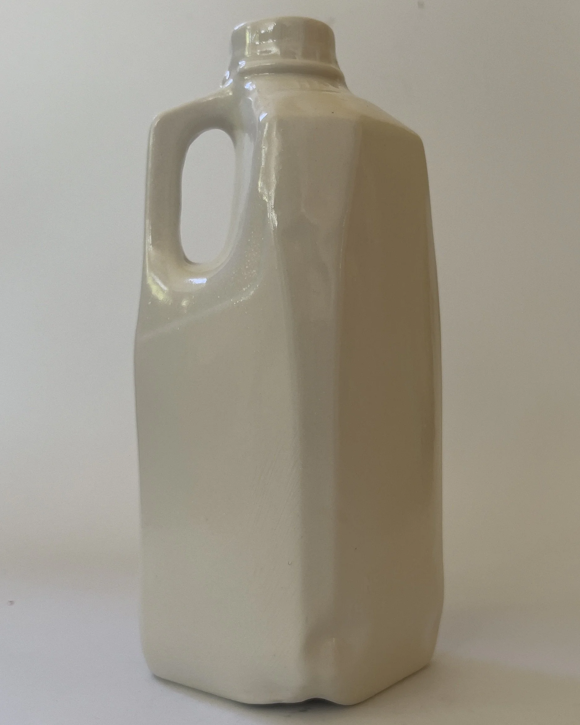 Side view showing handle and sculptural form of ceramic tall jug