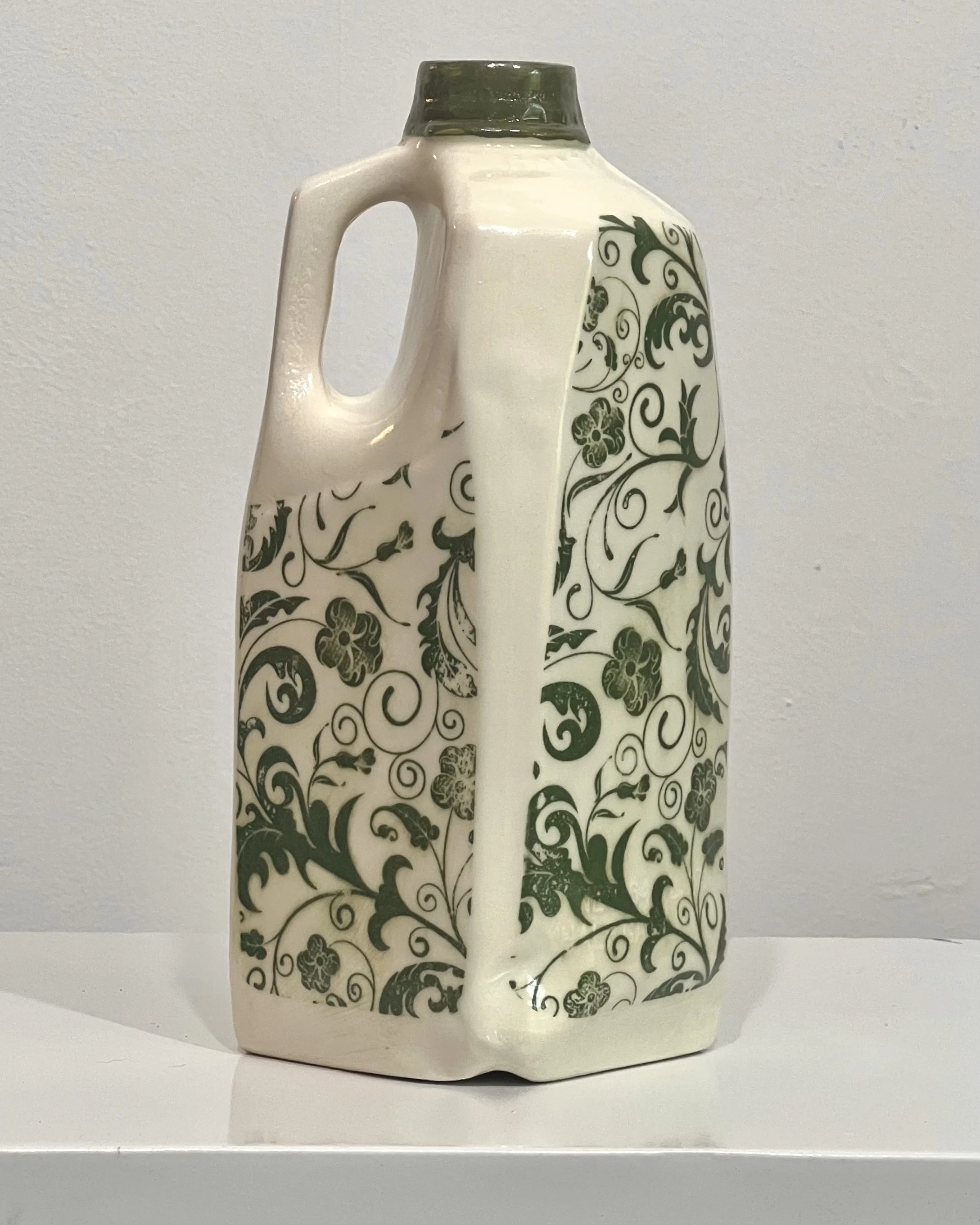 Back view of a one-of-a-kind botanical tall porcelain milk jug featuring continuous botanical imagery.