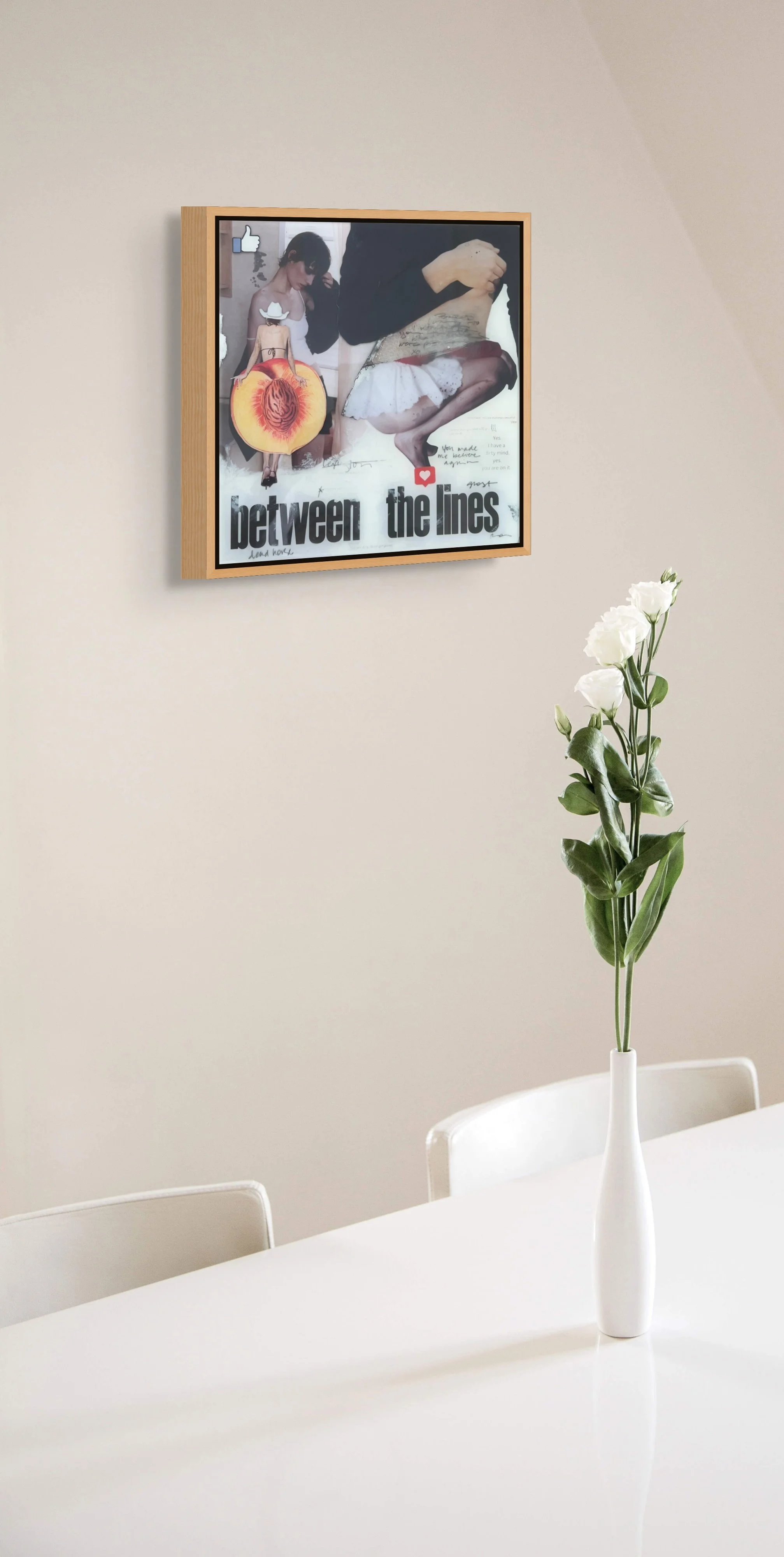 Contemporary feminist collage artwork by Alissa Van Atta displayed in a minimalist dining room interior with white flowers and neutral decor.