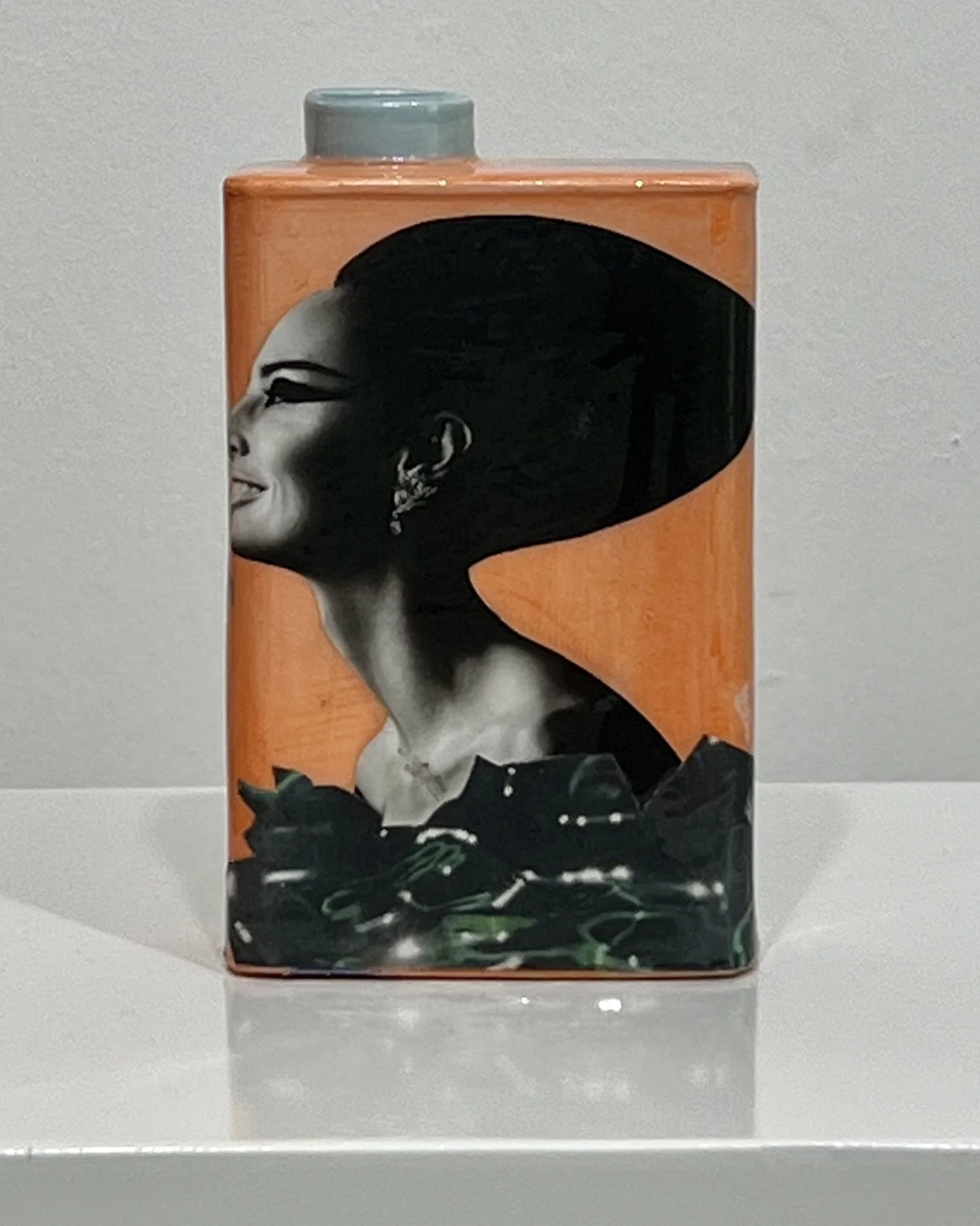 Front view of Time Bomb, a one-of-a-kind porcelain Art Carton with original collage, acrylic, and resin by Alissa Van Atta.