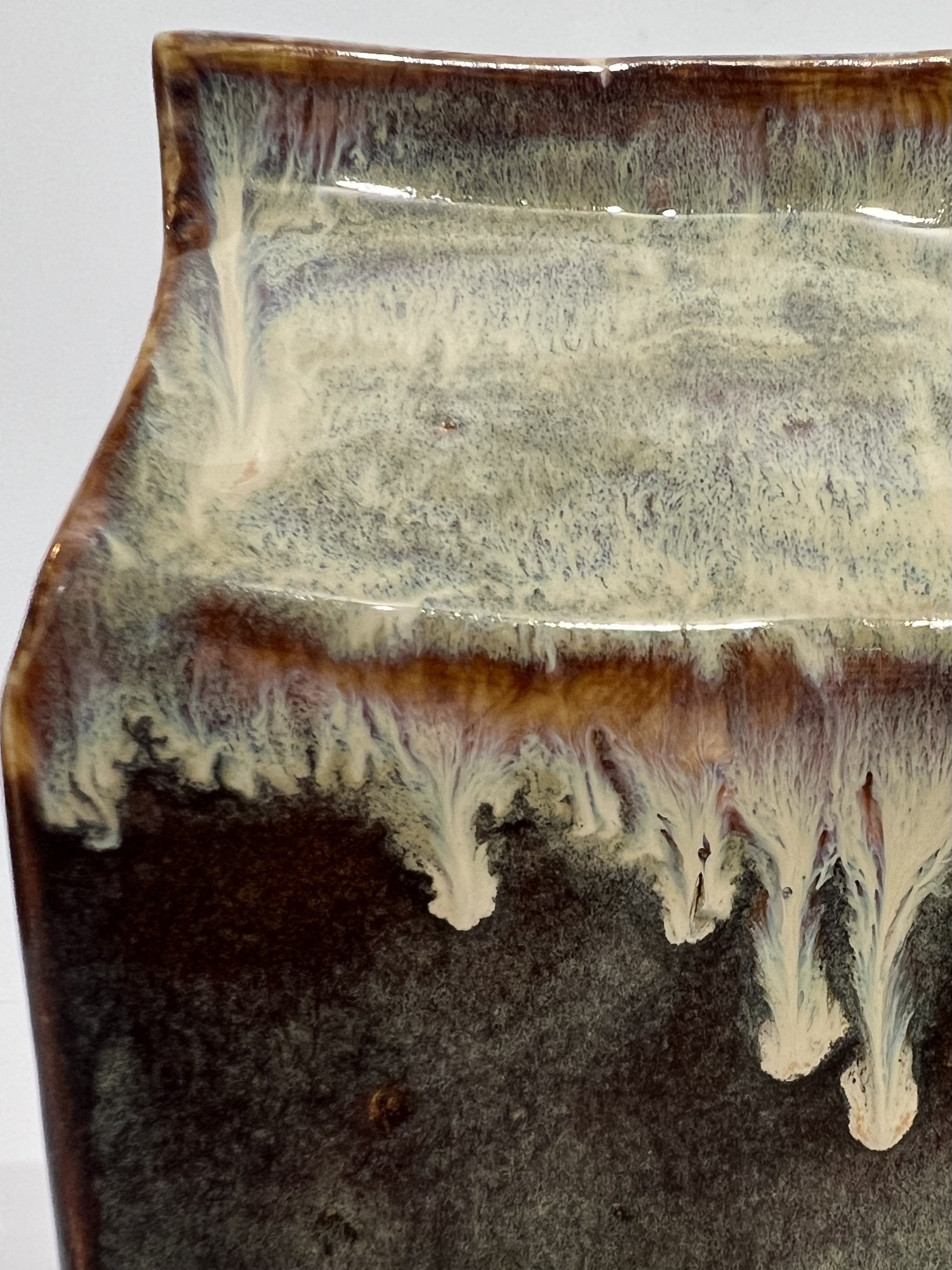 Close-up of Iron Lustre and Light Flux glaze detail on porcelain