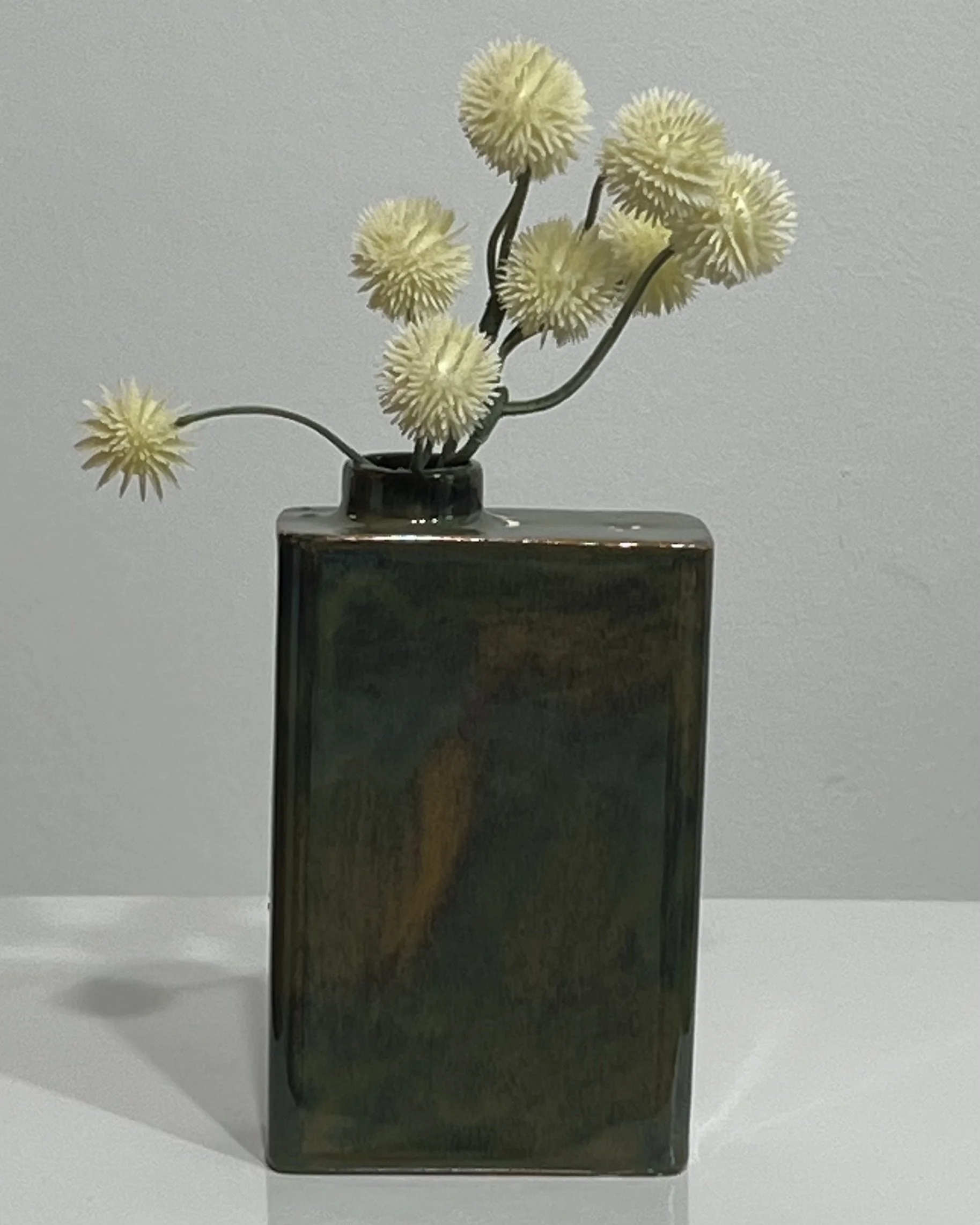 Mood Ring porcelain carton vase with yellow flowers, handmade by Alissa Van Atta