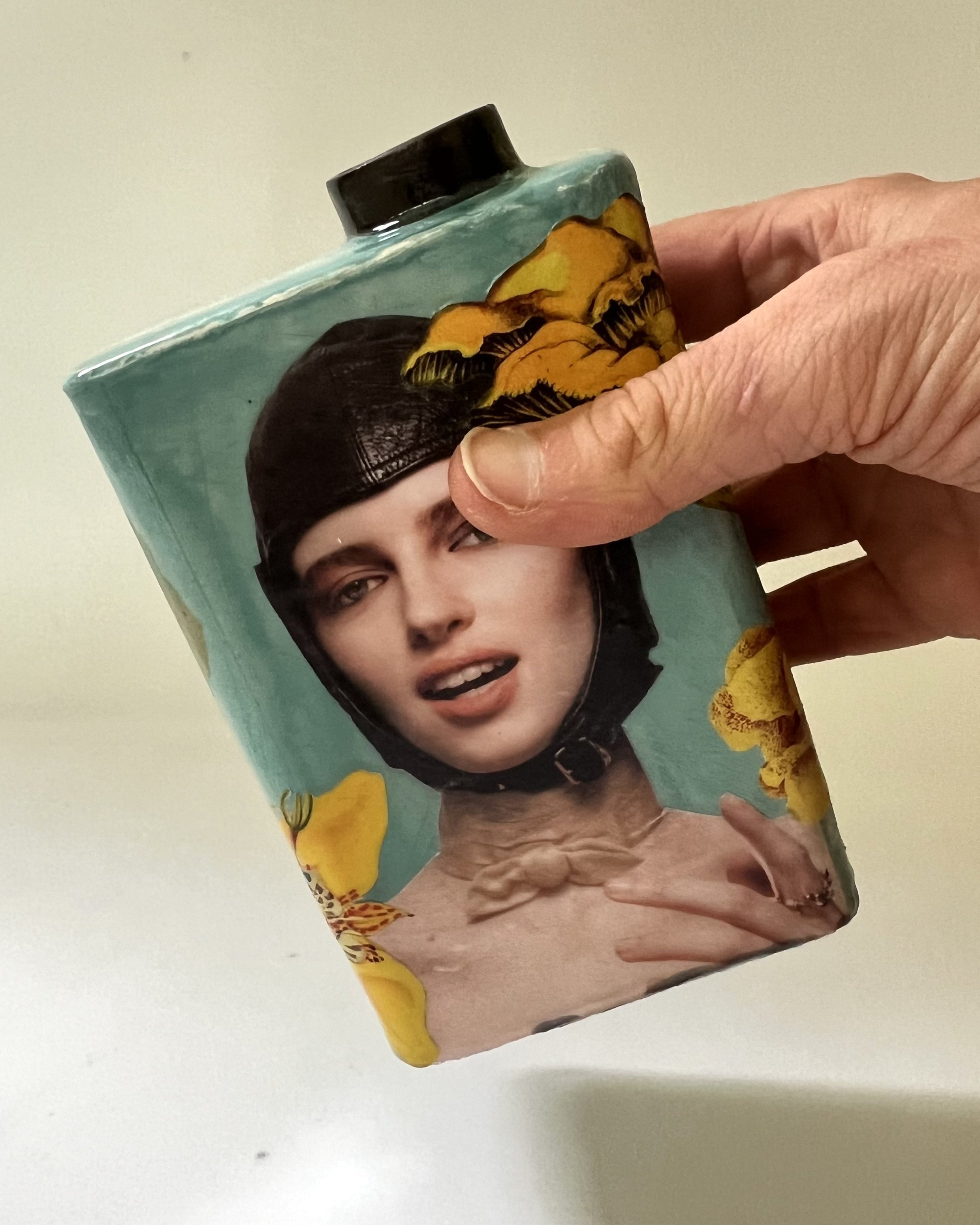 First in Flight porcelain Art Carton shown in hand for scale, handmade by Asheville artist Alissa Van Atta.