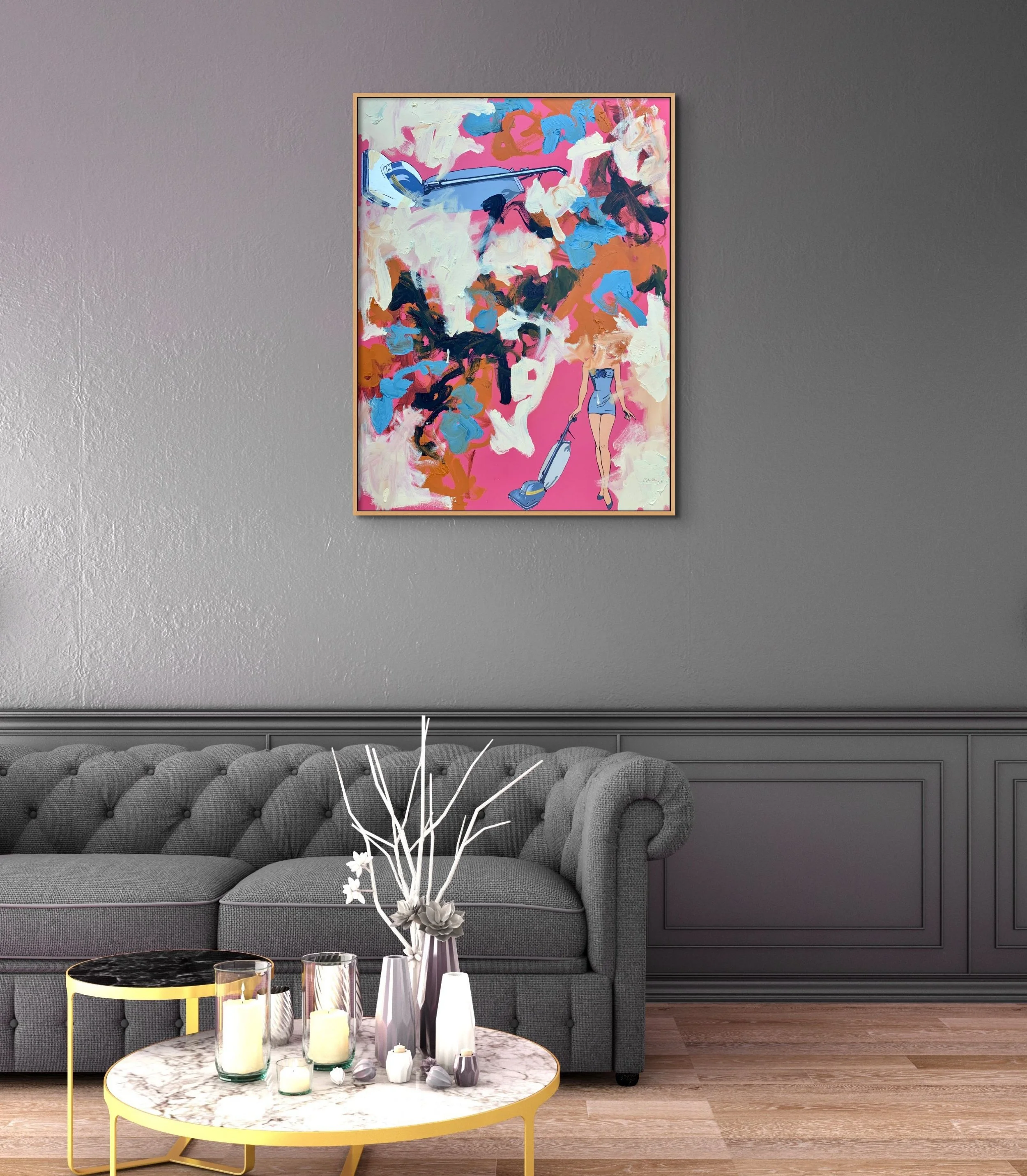 Life in a Vacuum, a colorful 40 by 30 inch original painting by Alissa Van Atta, displayed above a dark gray sofa in a contemporary living room.