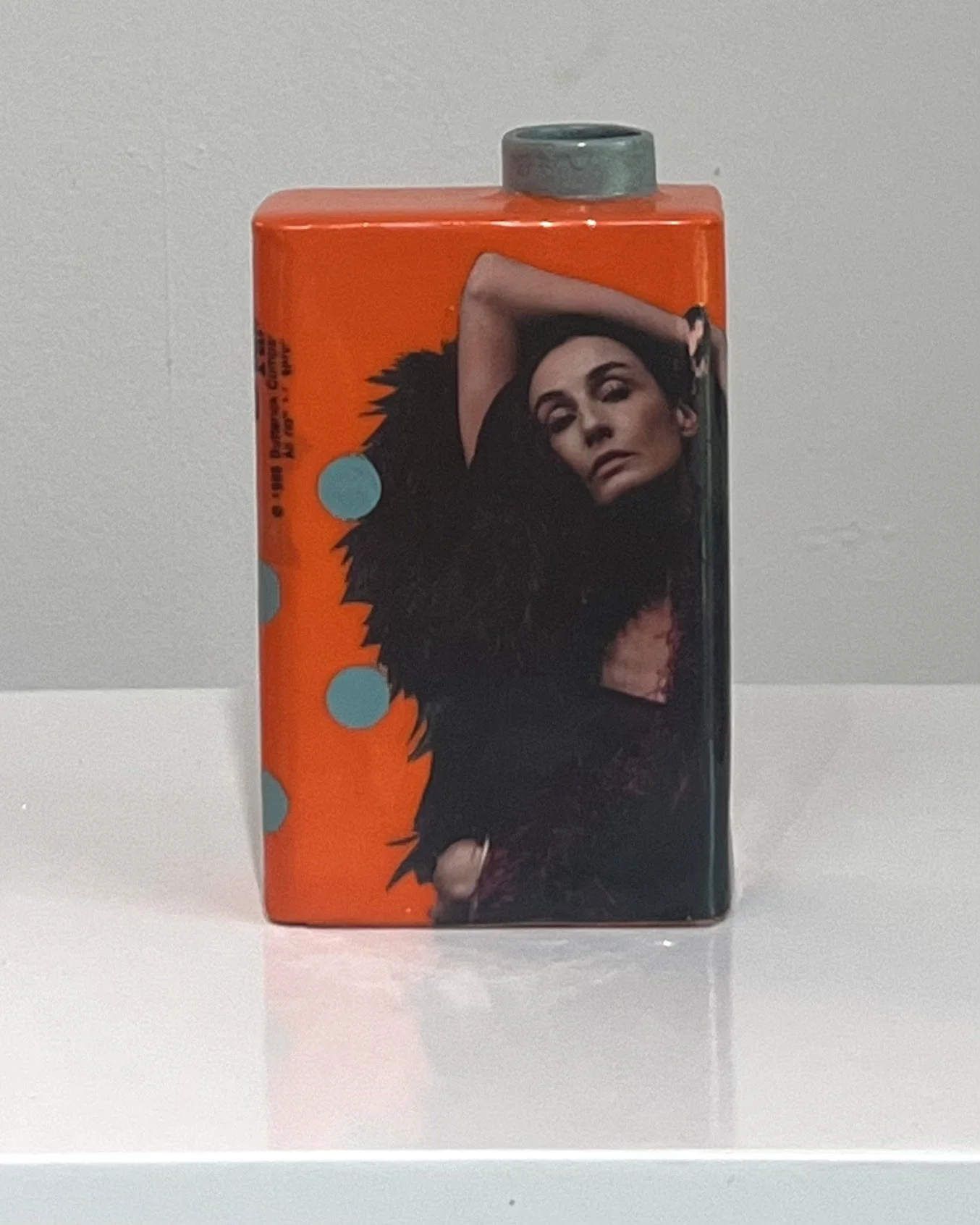 Front view of She Kept Her Feathers Sharp, a one-of-a-kind porcelain Art Carton with original collage, acrylic, and resin by Alissa Van Atta.