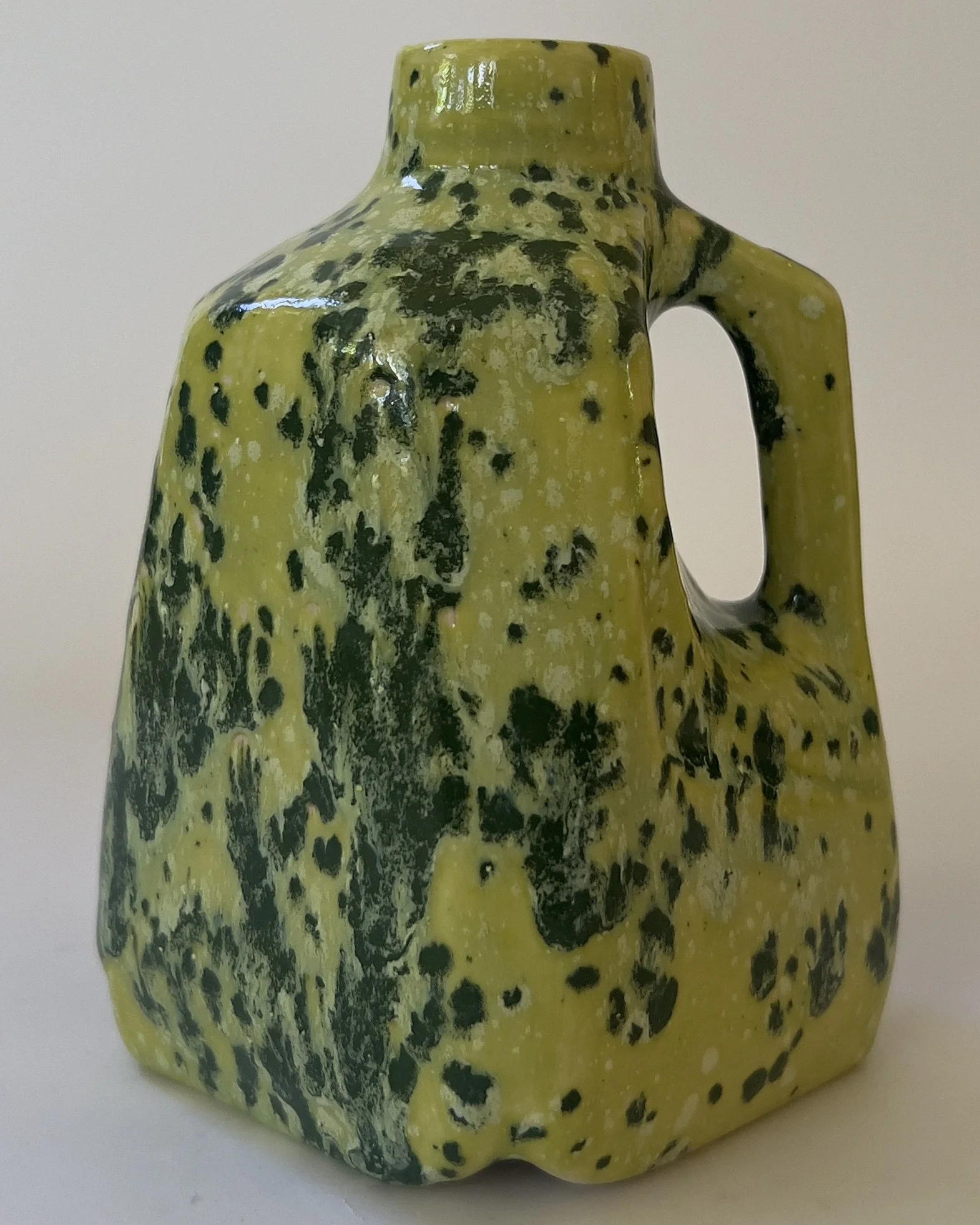 Handmade ceramic jug sculpture in Lime Shower glaze with chartreuse and dark moss mottled surface