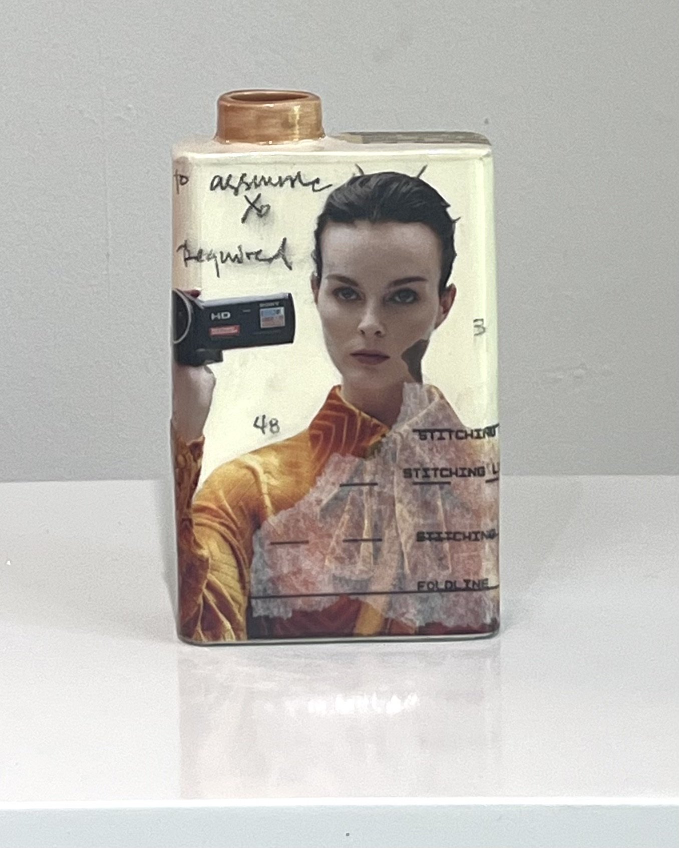 Front view of Some Assembly Required, a one-of-a-kind porcelain Art Carton with original collage, acrylic, and resin by Alissa Van Atta.