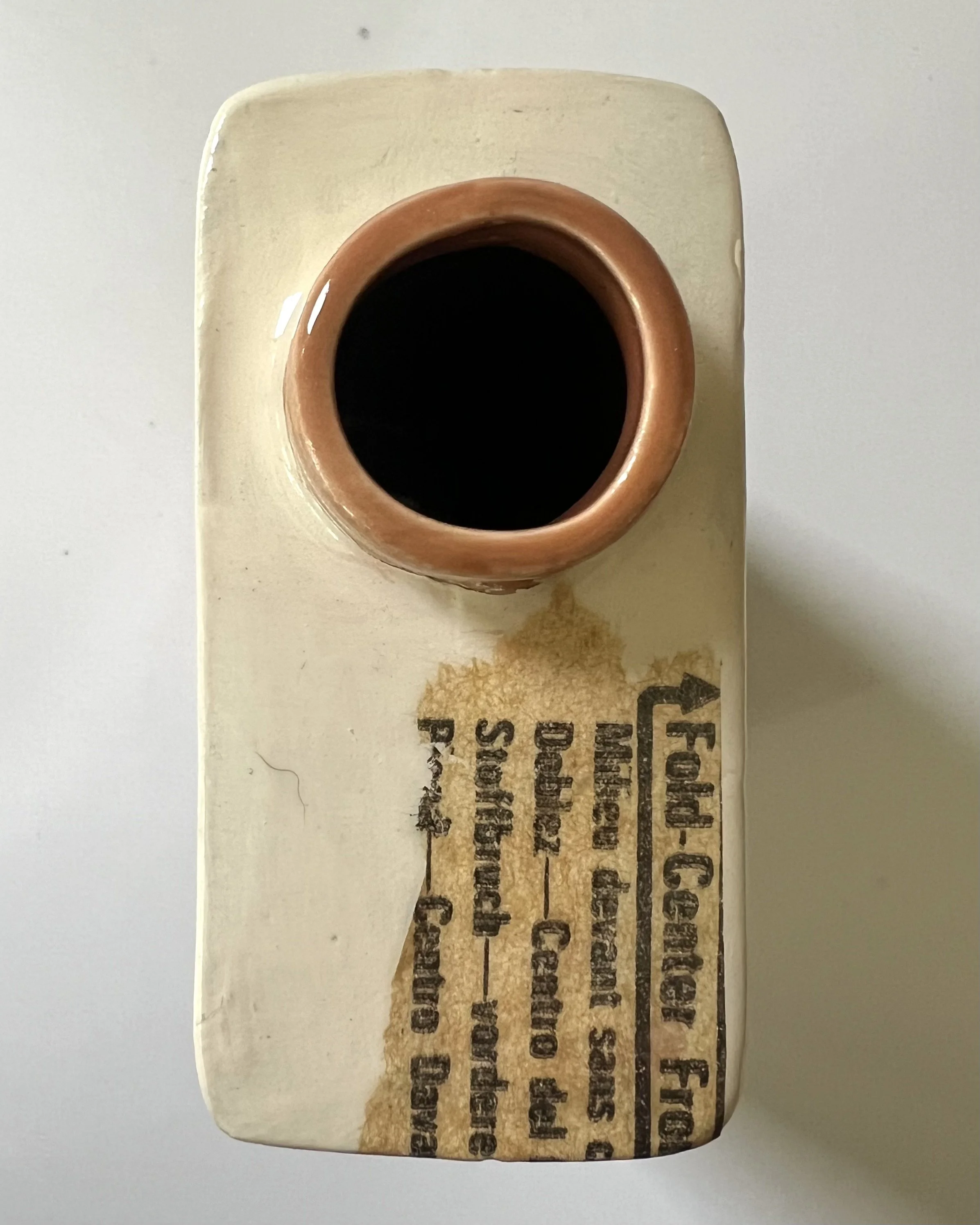 Top view of Some Assembly Required porcelain Art Carton showing the hand-cast ceramic opening and interior.