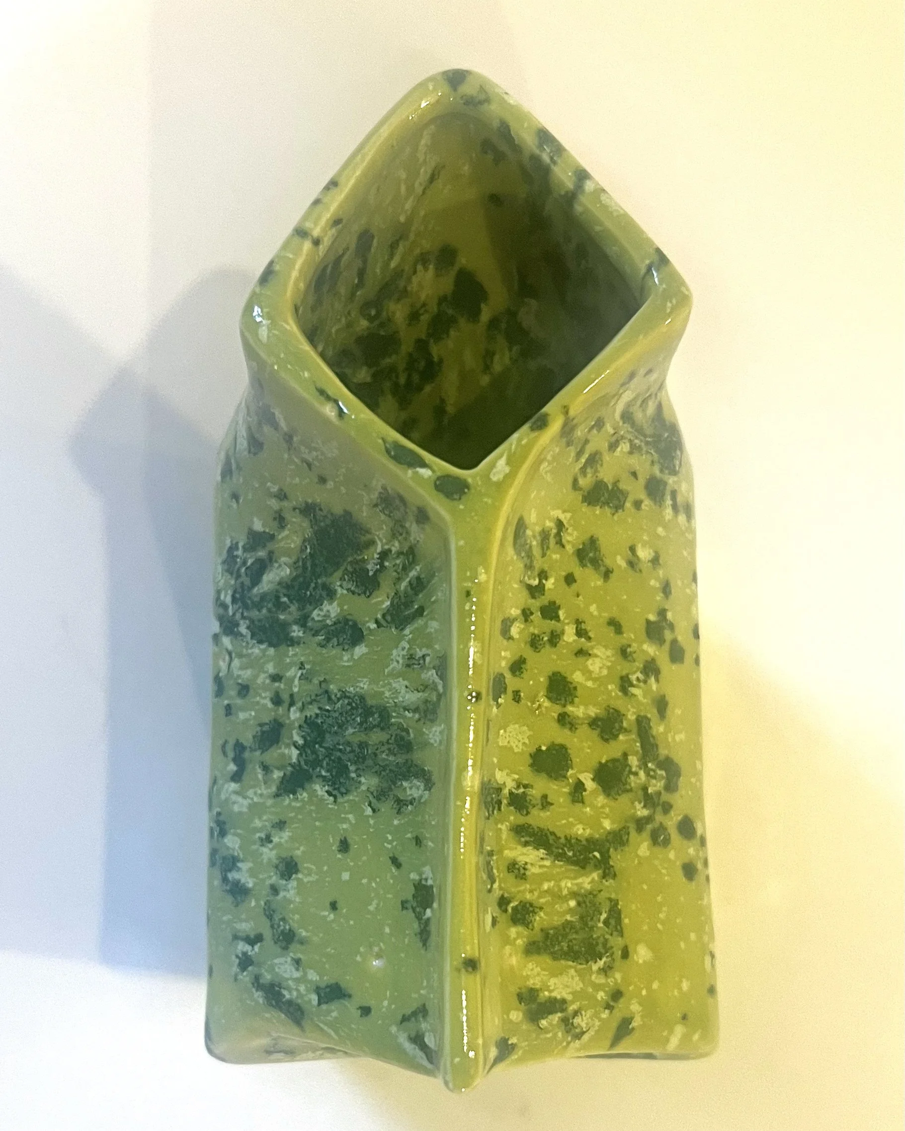 Top view showing glazed interior and folded opening of handmade porcelain milk carton sculpture.
