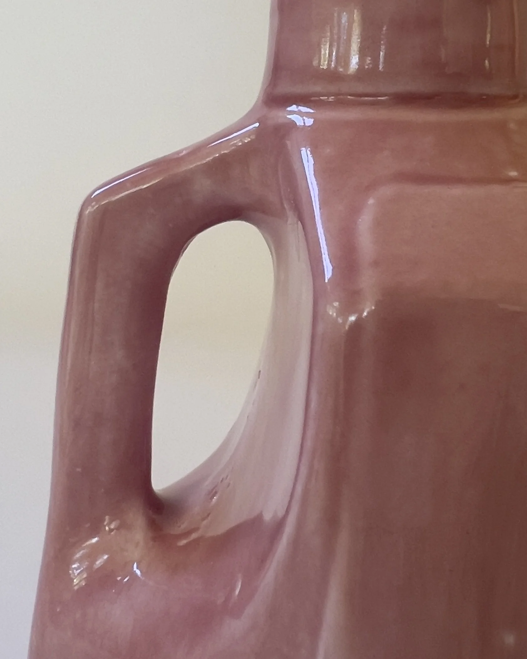 Close-up detail of ceramic jug handle with marbled Weeping Plum glaze