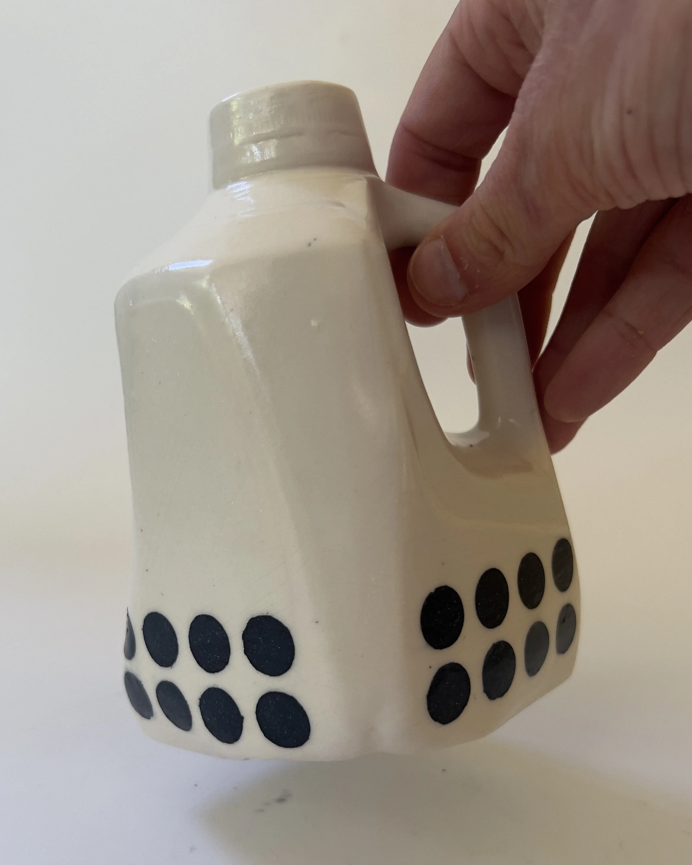 Scale reference of ceramic sculptural vessel held in hand