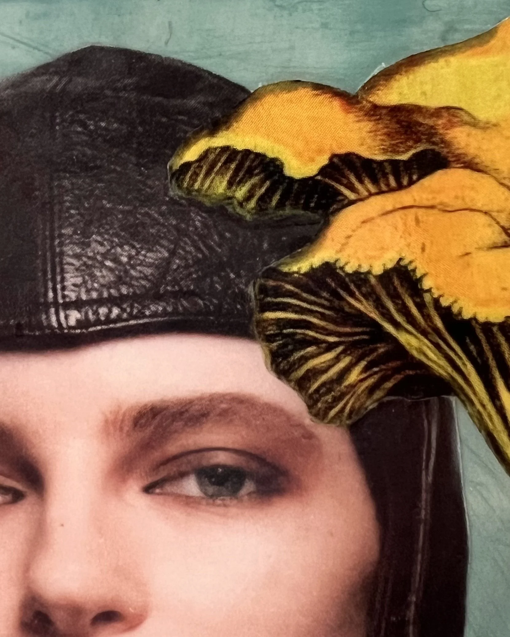 Detail of First in Flight highlighting vintage portrait collage, layered imagery, and resin surface.