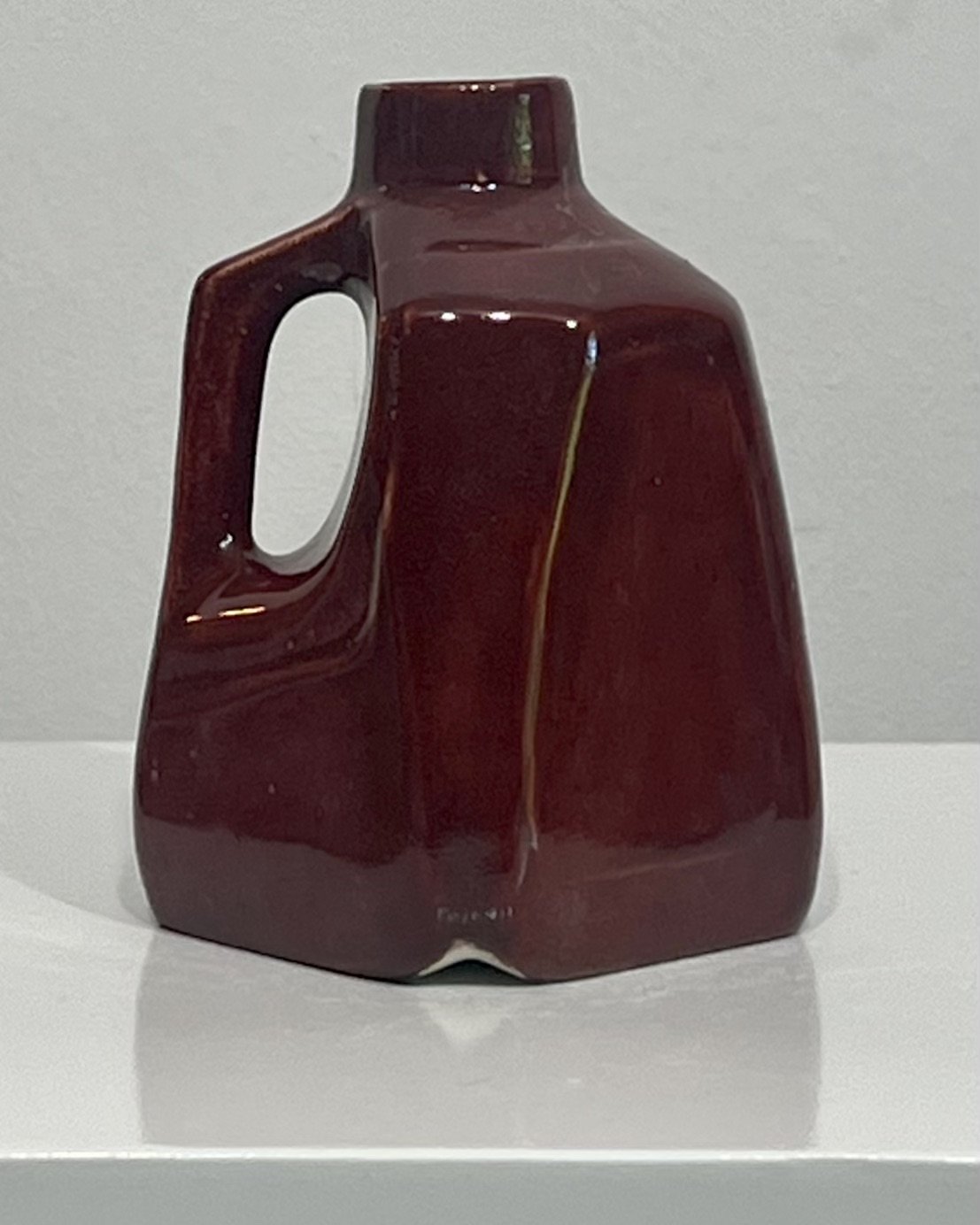 26.51 Deep Firebrick porcelain milk jug vase, right side view showing handle