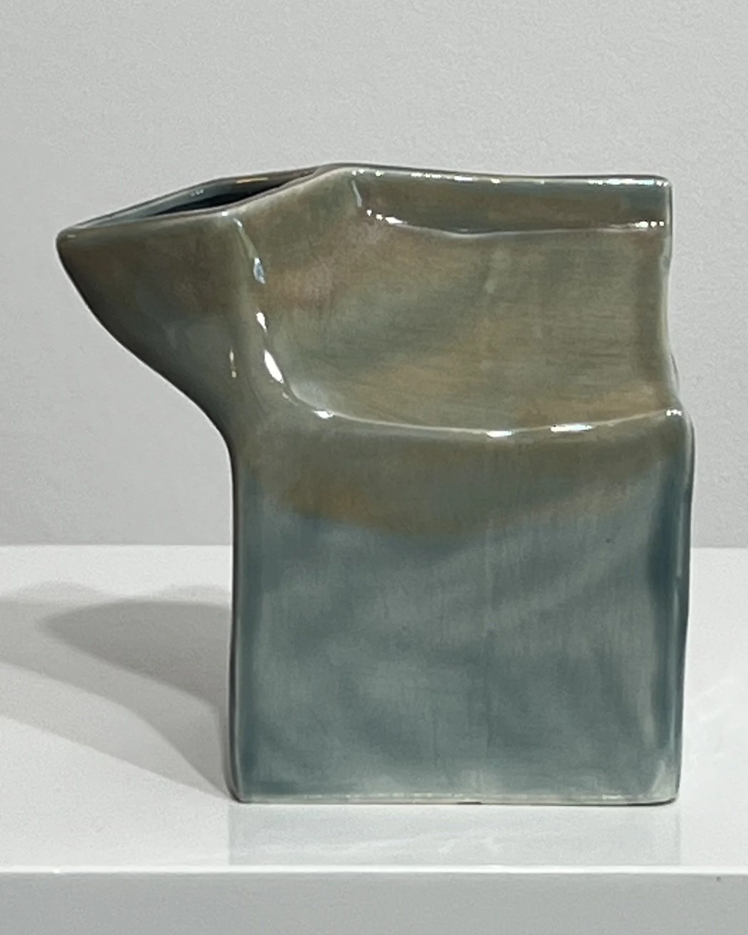 Handmade ceramic milk carton with layered Fog and Mystic Tide blue-green glazes, front view.