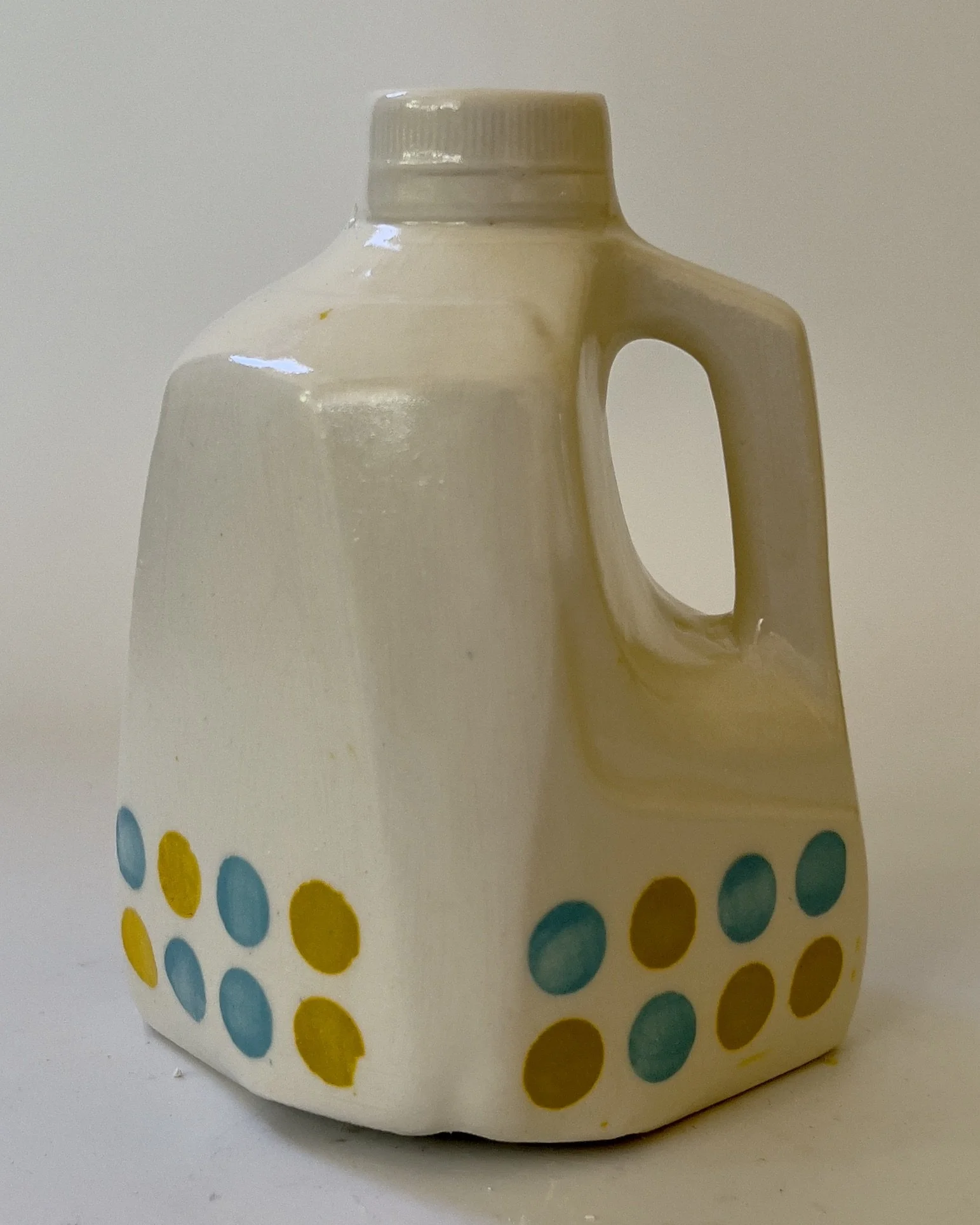 Handbuilt white ceramic jug sculpture with jade and dandelion polka dots