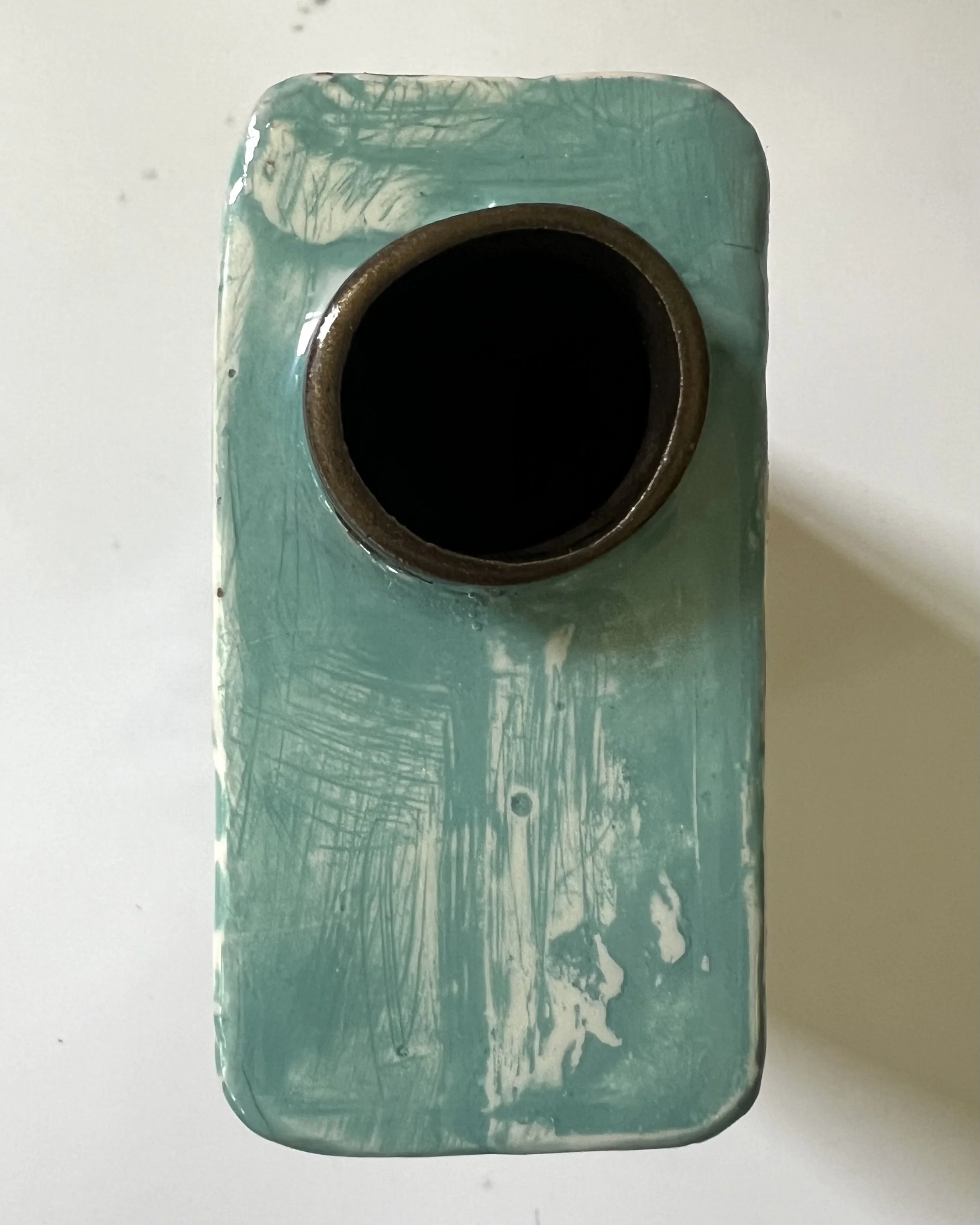 Top view of First in Flight porcelain Art Carton showing the hand-cast ceramic opening and interior.