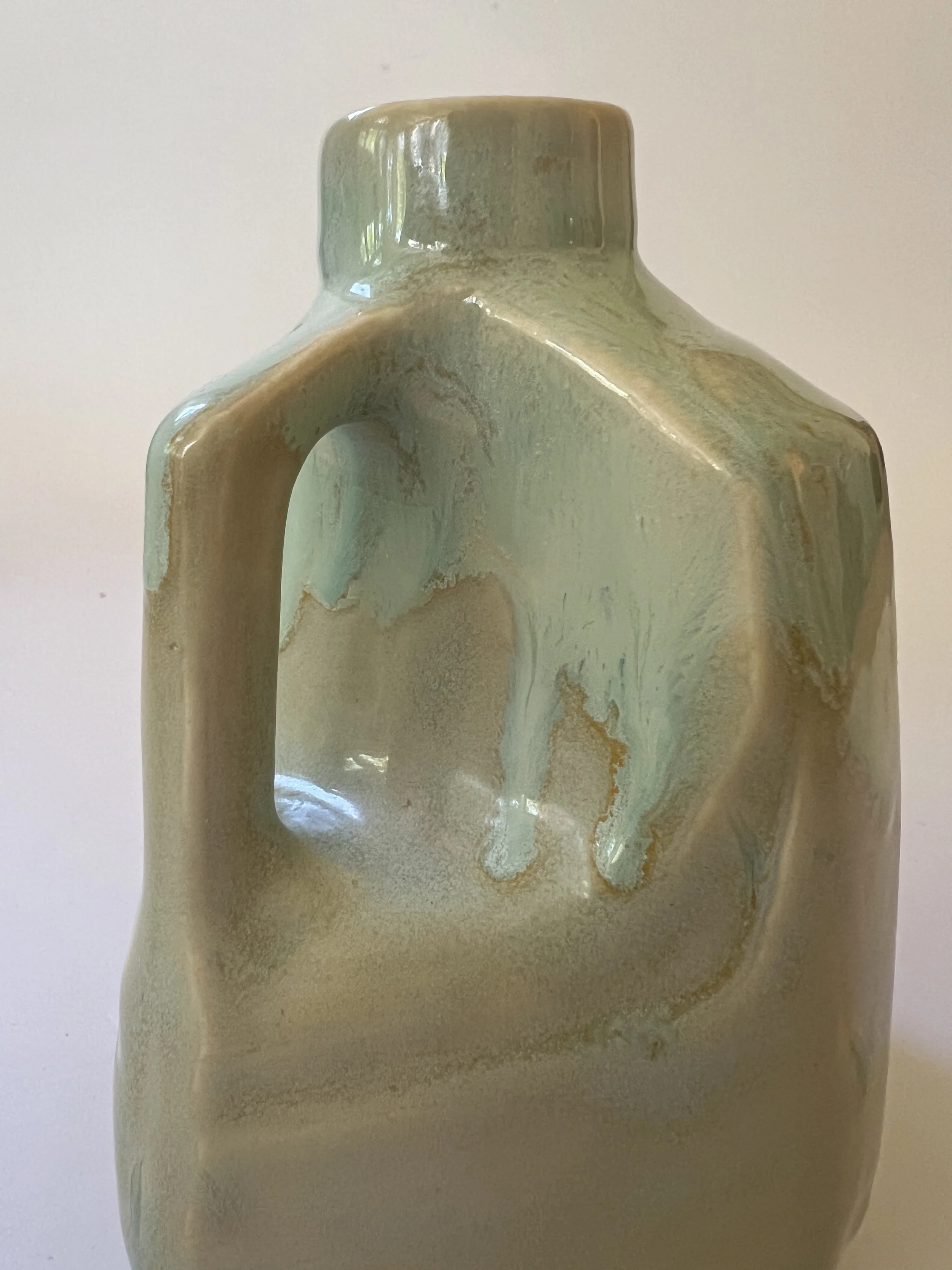 Close-up detail of integrated handle on handmade ceramic jug vase