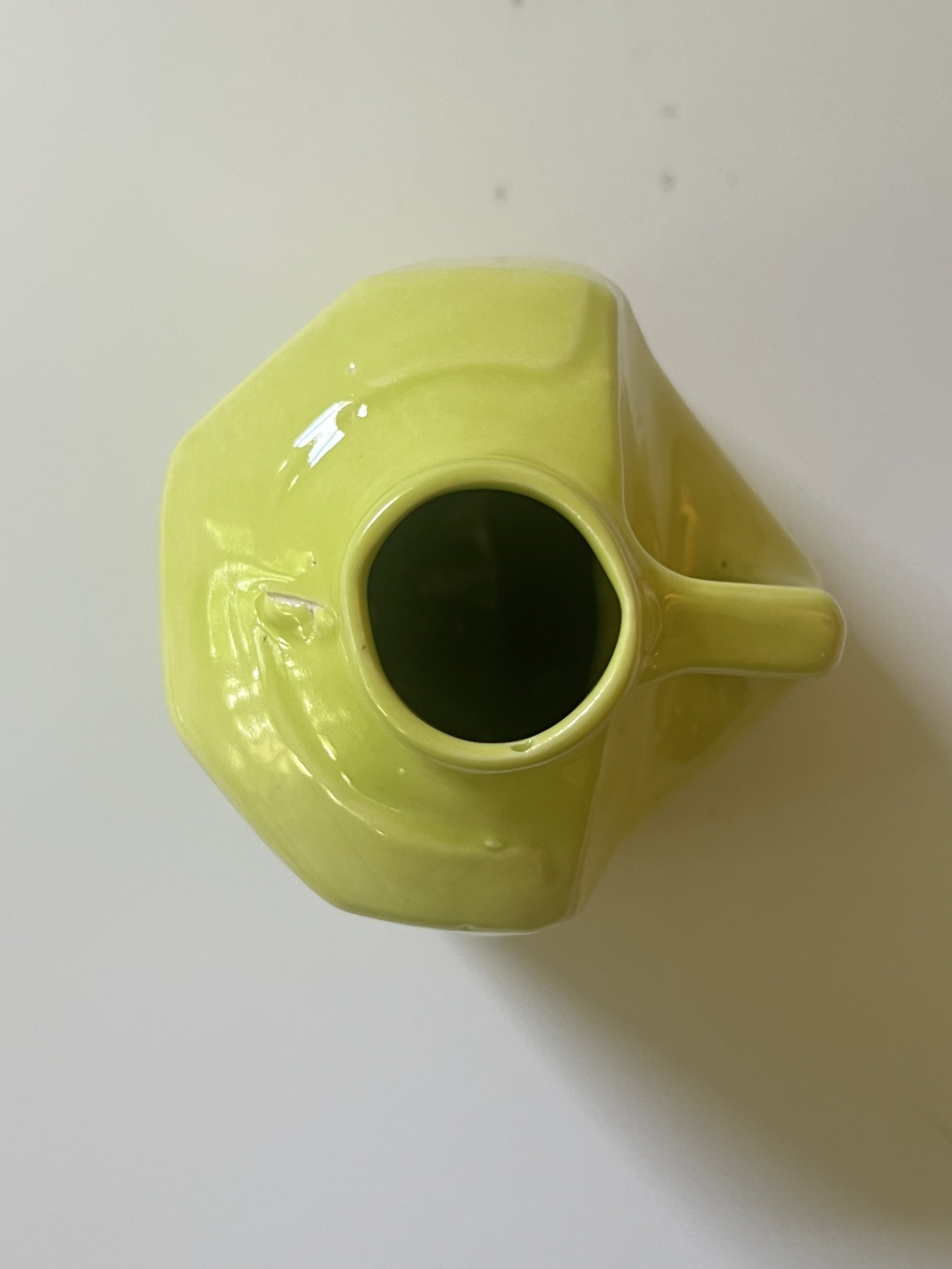 Close-up detail of glossy Pear glaze on handmade ceramic vessel.