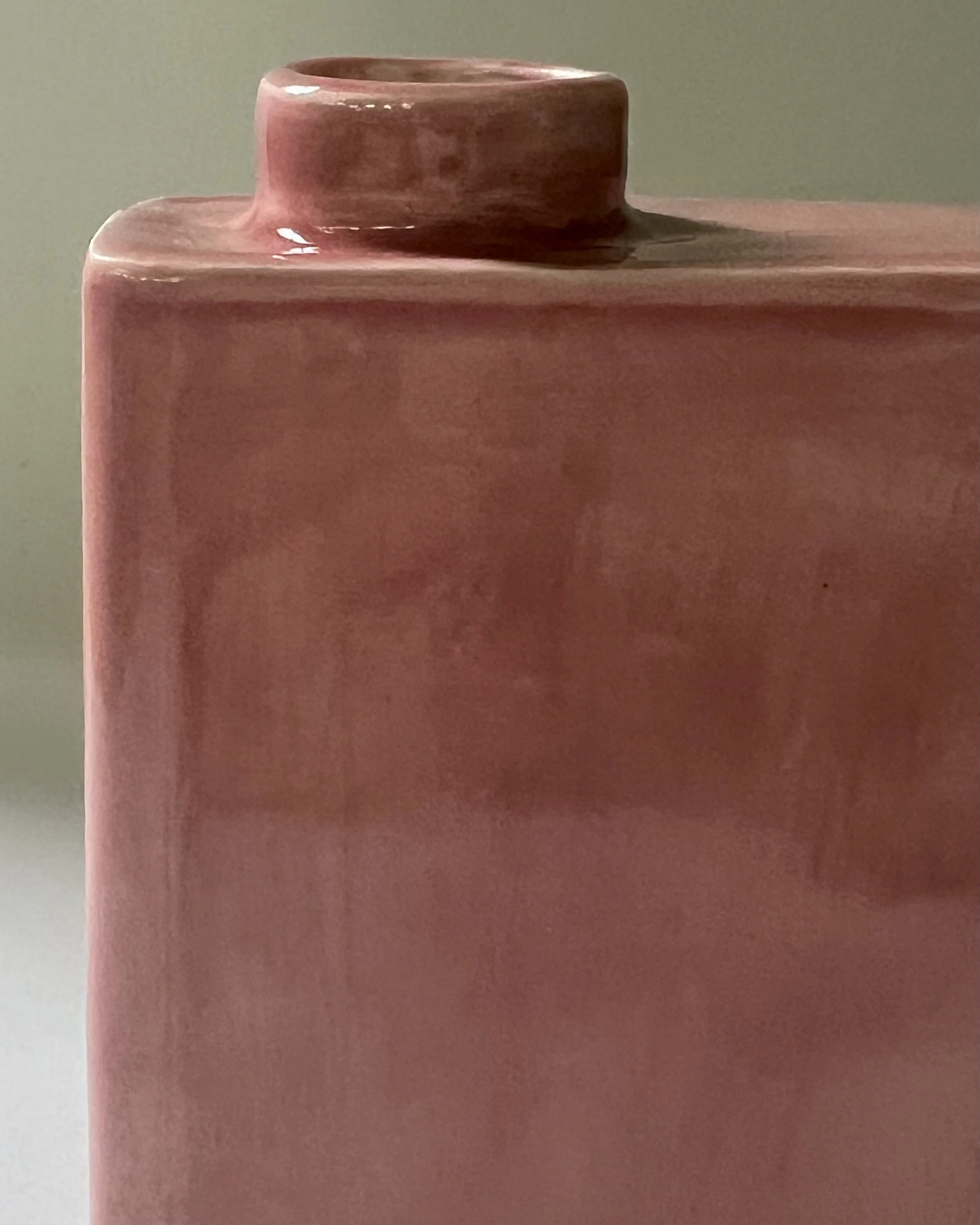 Close-up detail of Weeping Plum glaze showing layered blush, rose, and mauve tones on porcelain.