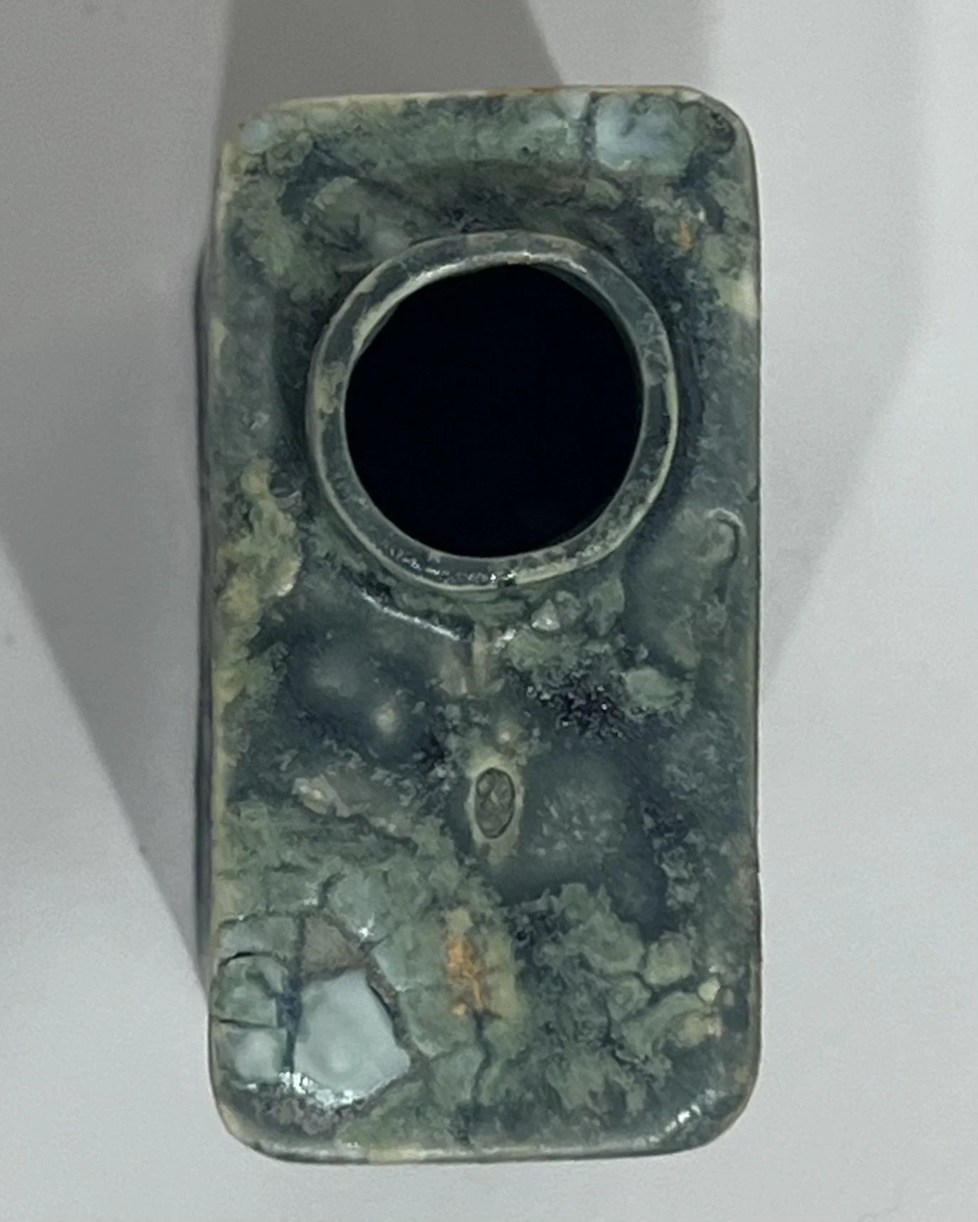 Top view of handmade porcelain Carton vessel showing the narrow opening and glazed rim.