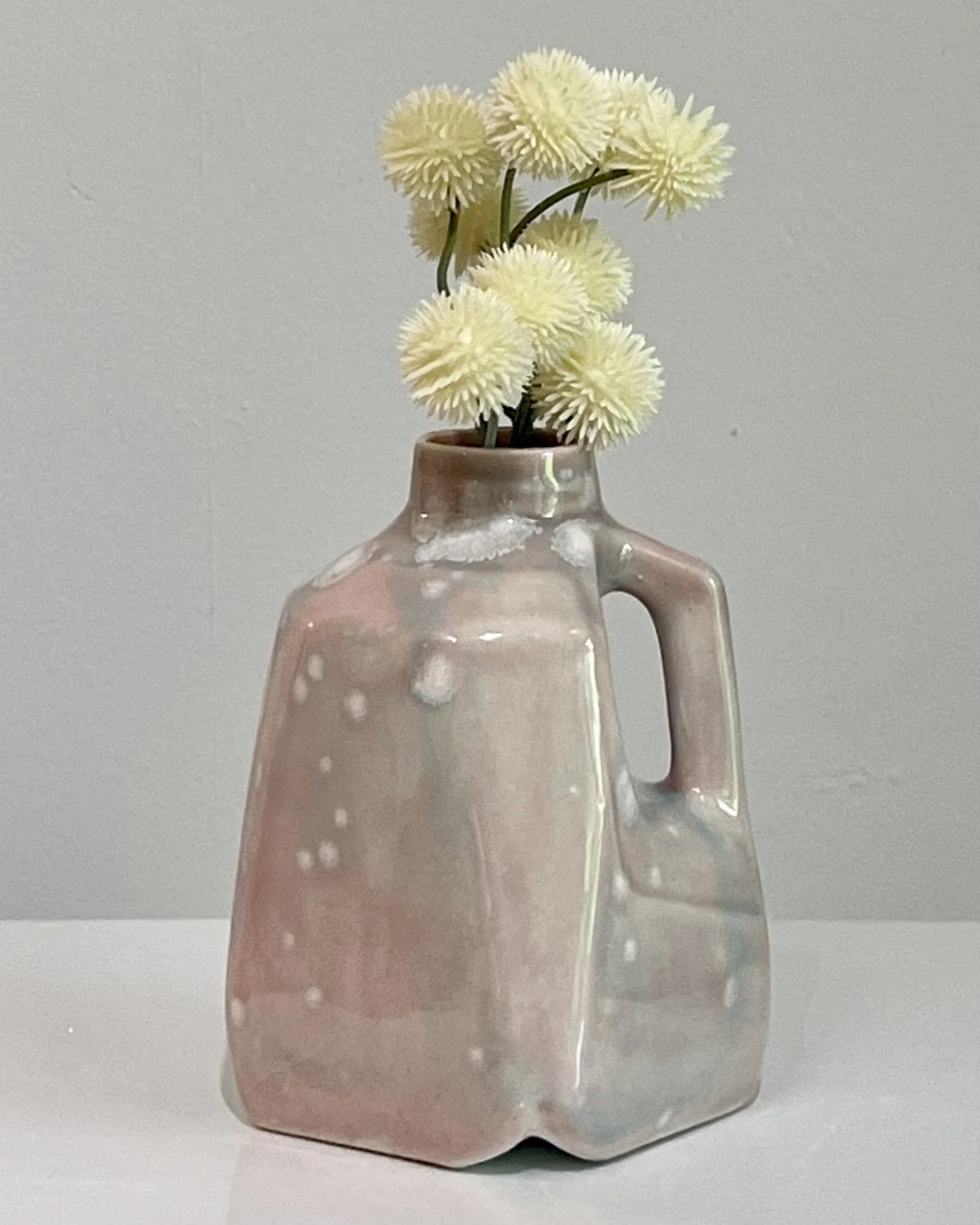Celadon Bloom over Cherry Blossom porcelain milk jug with flowers by Alissa Van Atta.