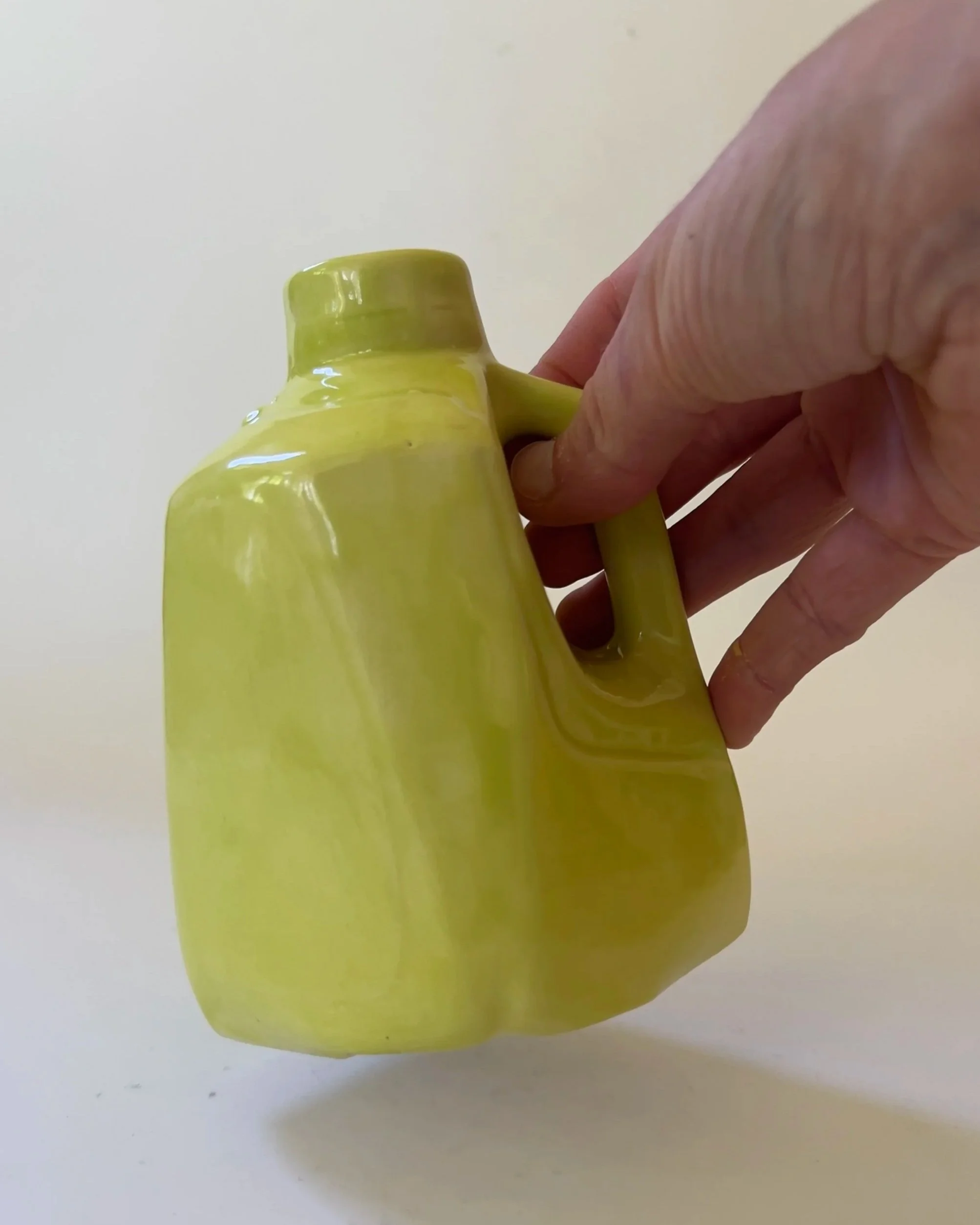 pear-jug-26-34-scale-in-hand.jpg
