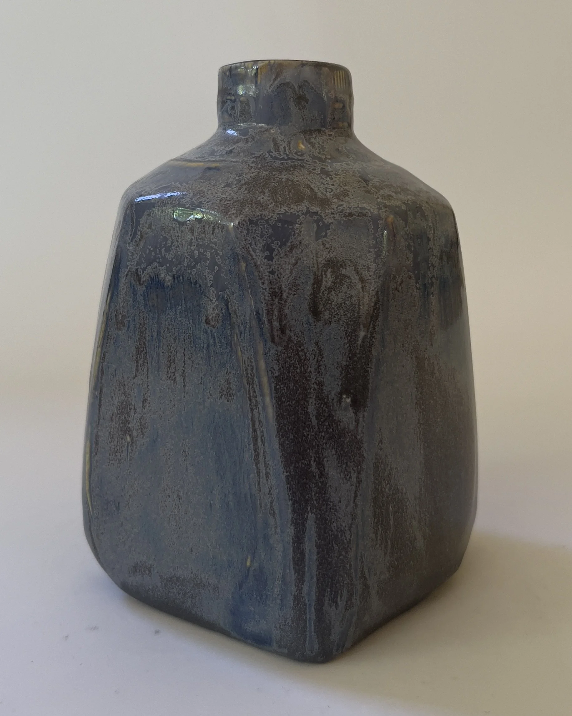 Back view of sculptural ceramic vessel with atmospheric blue gray glaze