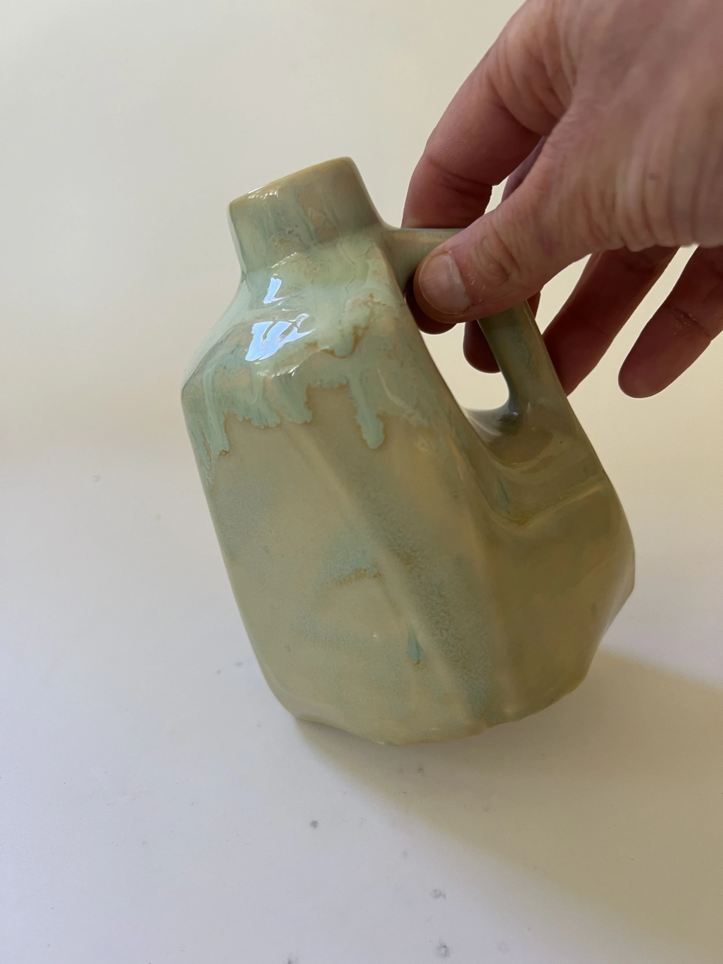 jug-26-42-scale-reference.jpeSmall handmade ceramic jug shown in hand for size reference