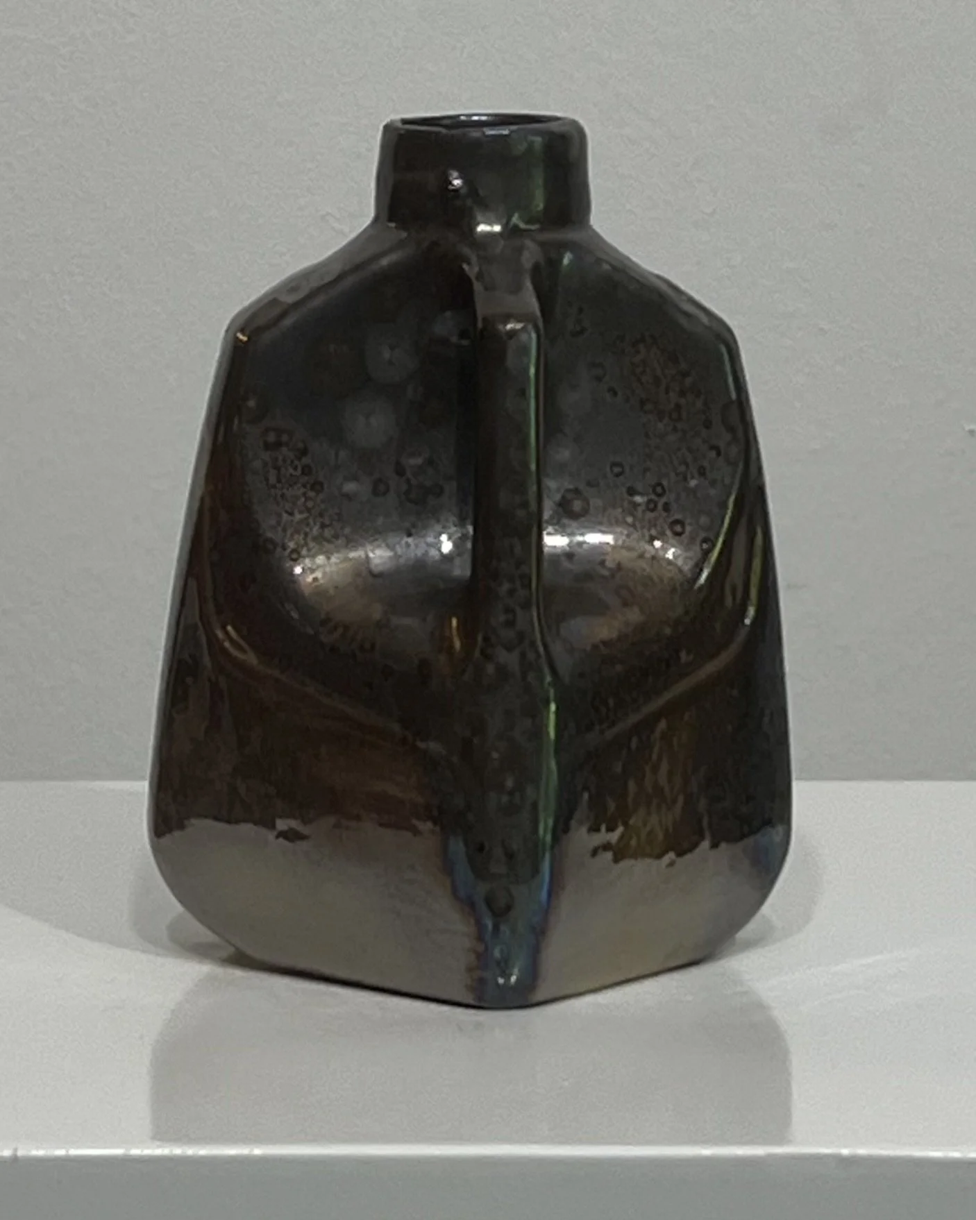 Rear detail of porcelain milk jug vase showing sculptural form