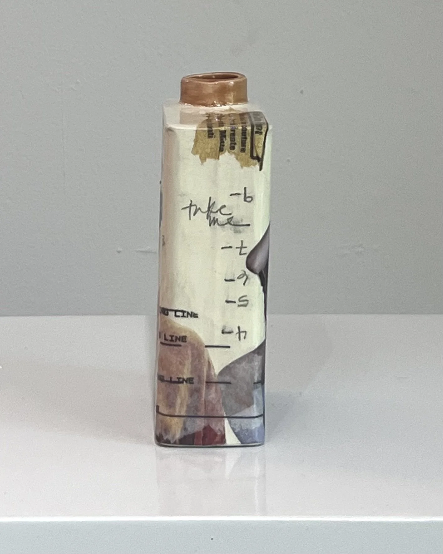 Right side view of Some Assembly Required porcelain Art Carton with layered collage and mixed media by Alissa Van Atta.