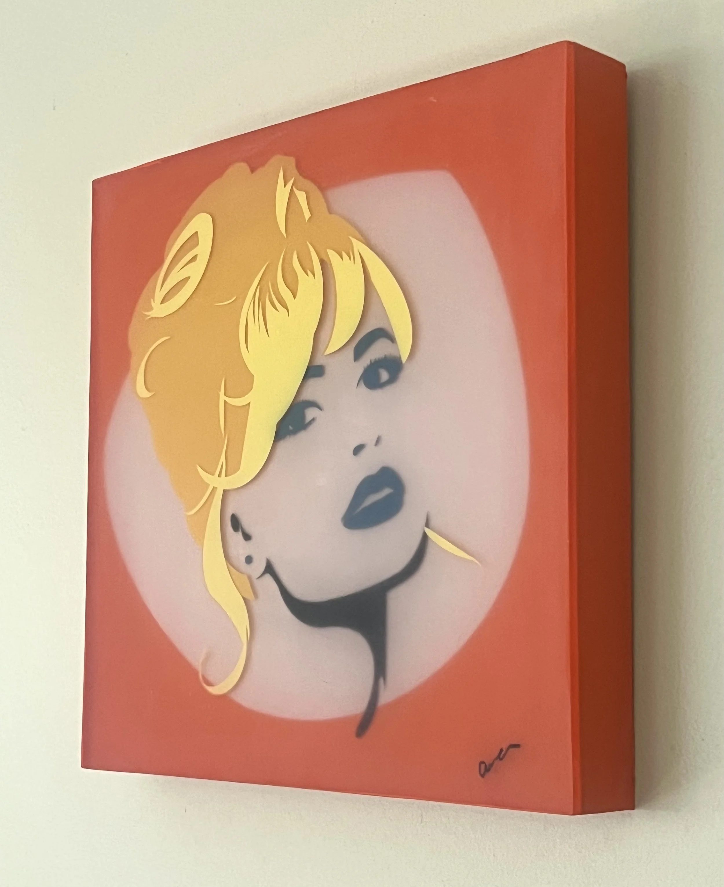 Angled photograph of Bridgette revealing the depth of the layered resin portrait on cradled wood