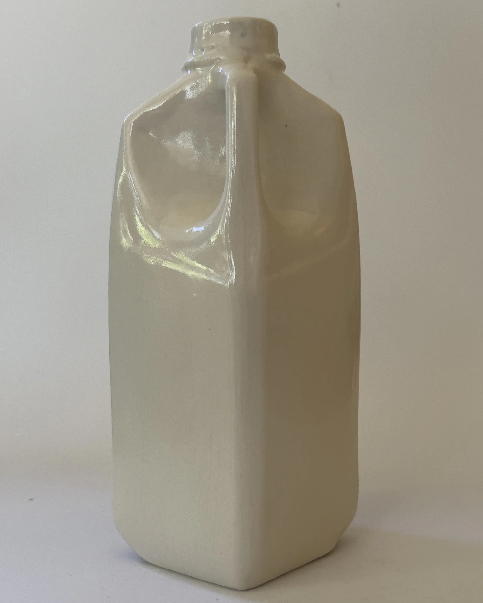 Back view of handmade white ceramic jug vase