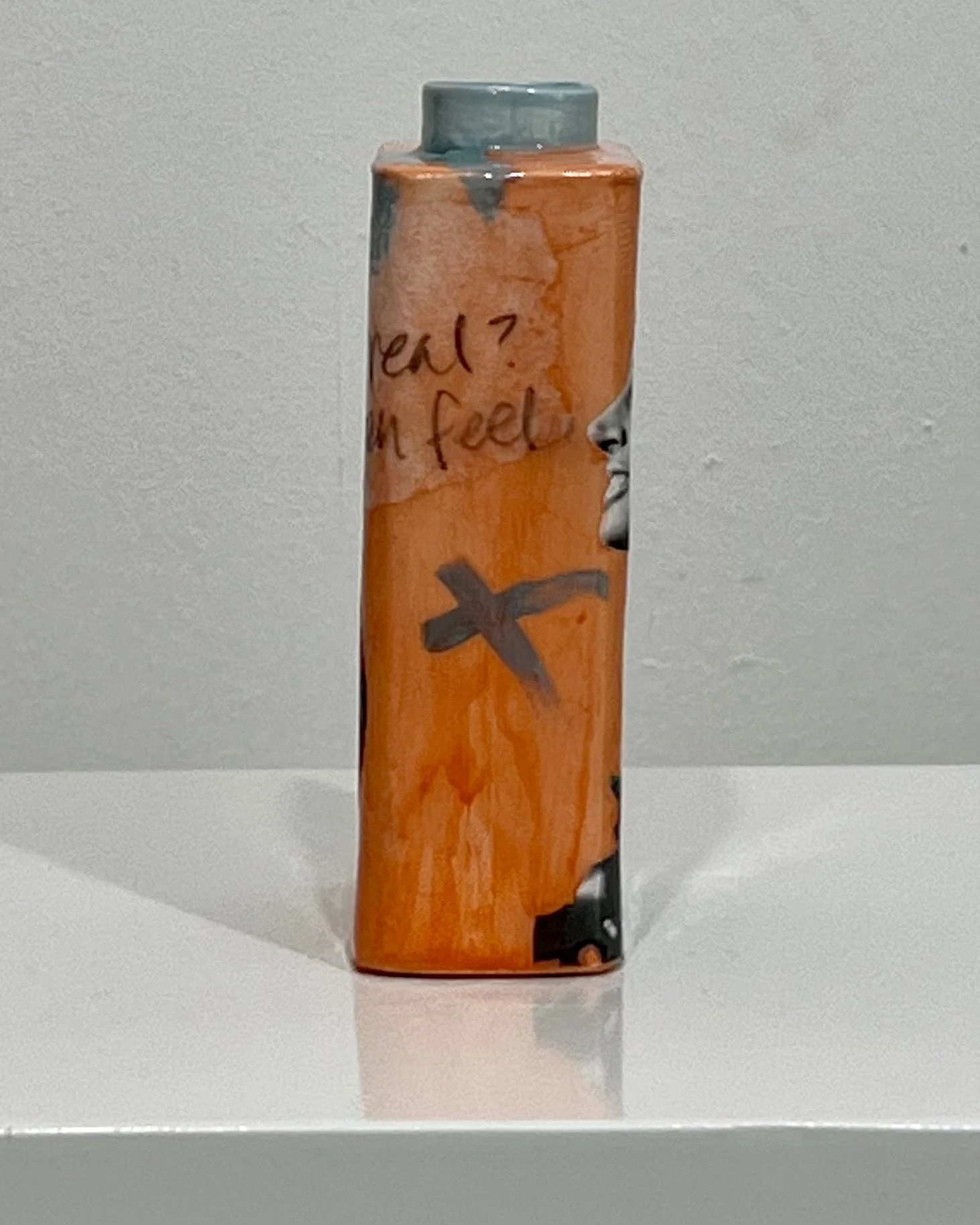 Left side view of Time Bomb porcelain Art Carton showing layered collage imagery and contemporary mixed media details.
