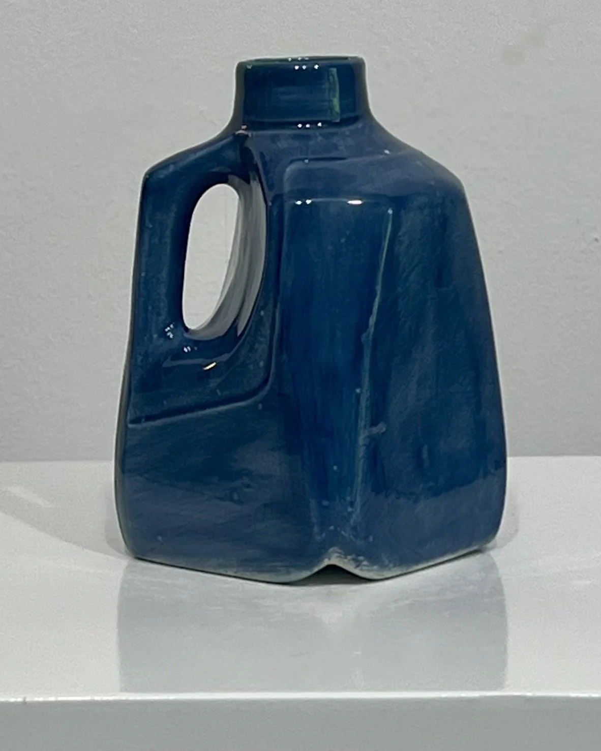 Side view of handmade porcelain Milk Jug 26.55 in Deep Sea glaze