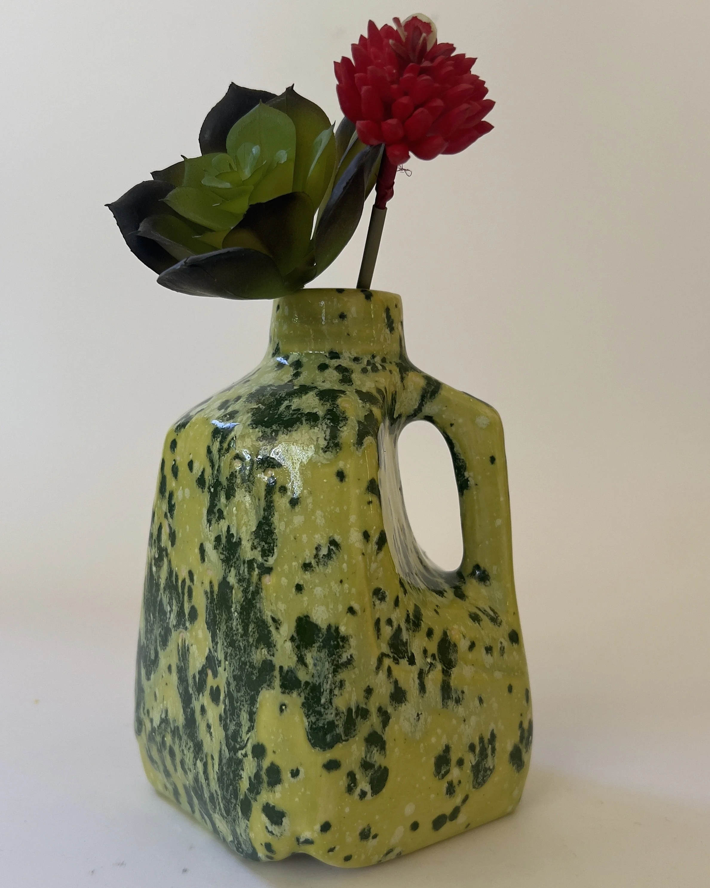 Ceramic jug vase with flowers in chartreuse Lime Shower glaze