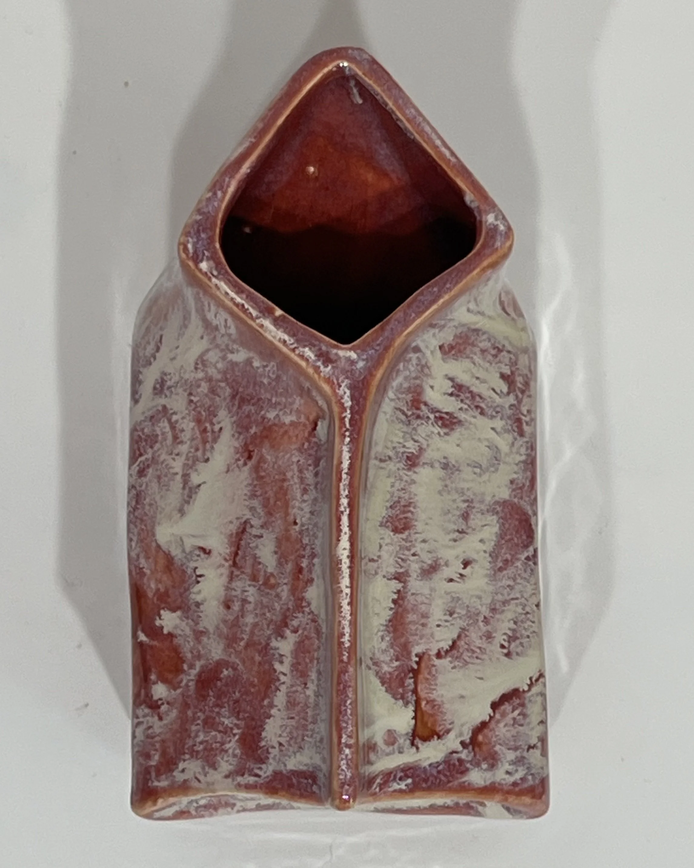 Top view of the ceramic milk carton showing the open vessel and handbuilt folded carton form.