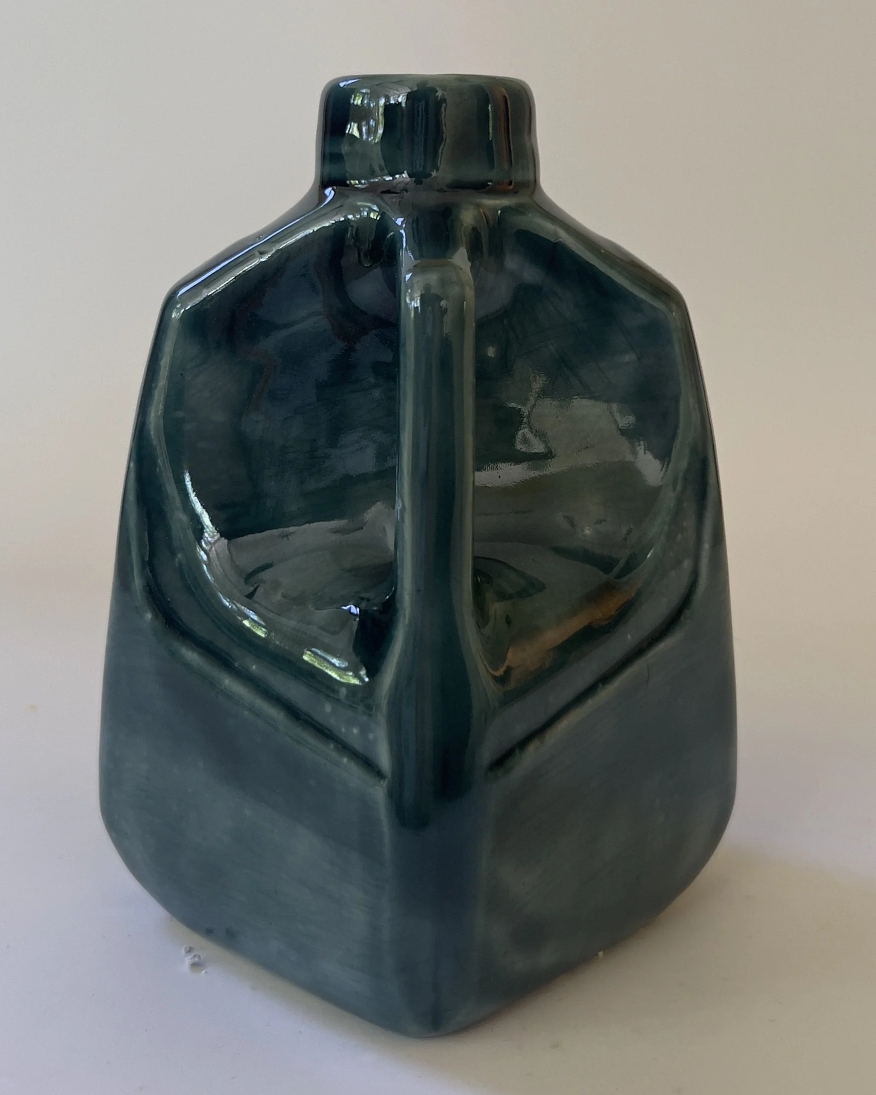 Back view of handmade geometric ceramic jug with glossy rainforest glaze