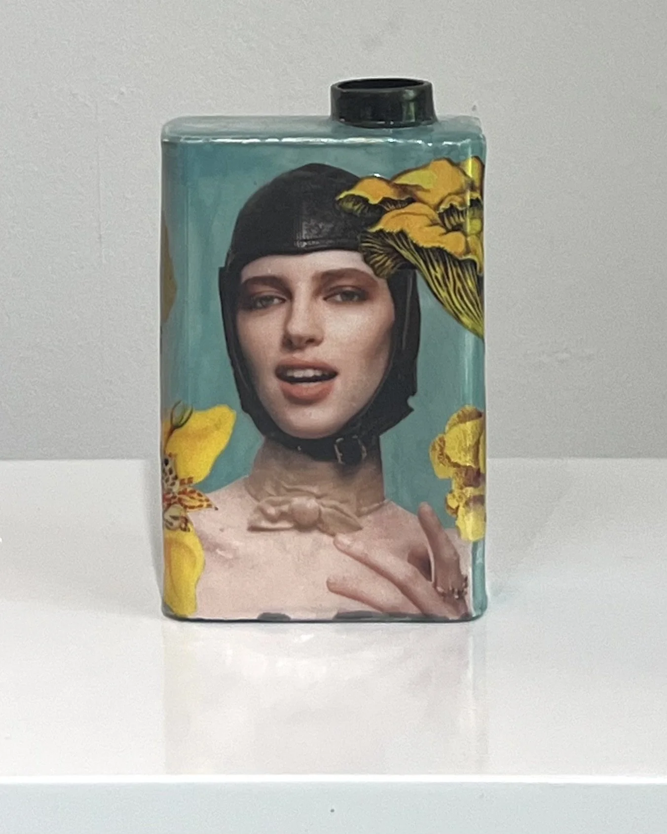 Front view of First in Flight, a one-of-a-kind porcelain Art Carton with original collage, acrylic, and resin by Alissa Van Atta.