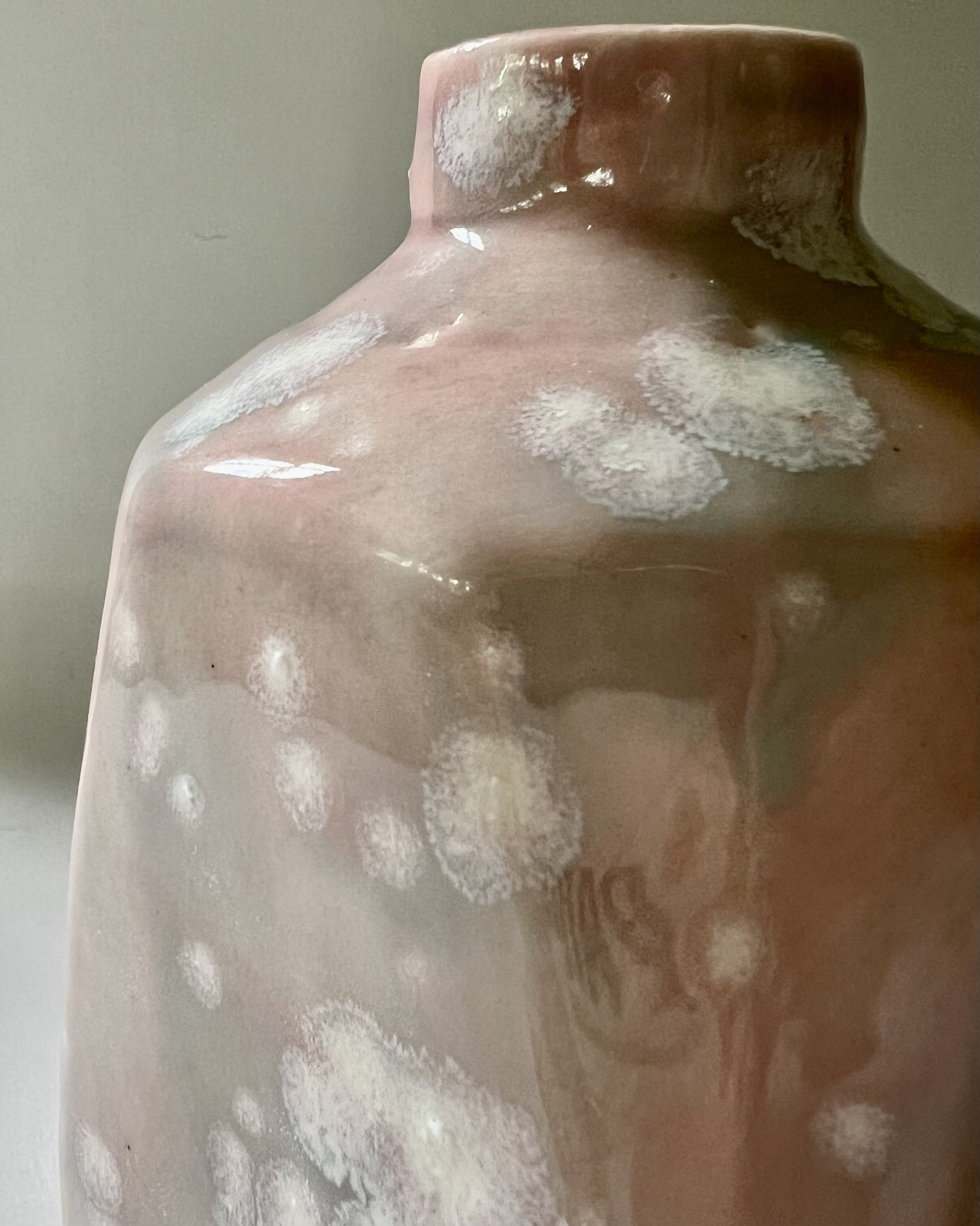 Close-up detail of Celadon Bloom over Cherry Blossom glaze with soft pink, sage green, and crystalline blooms.