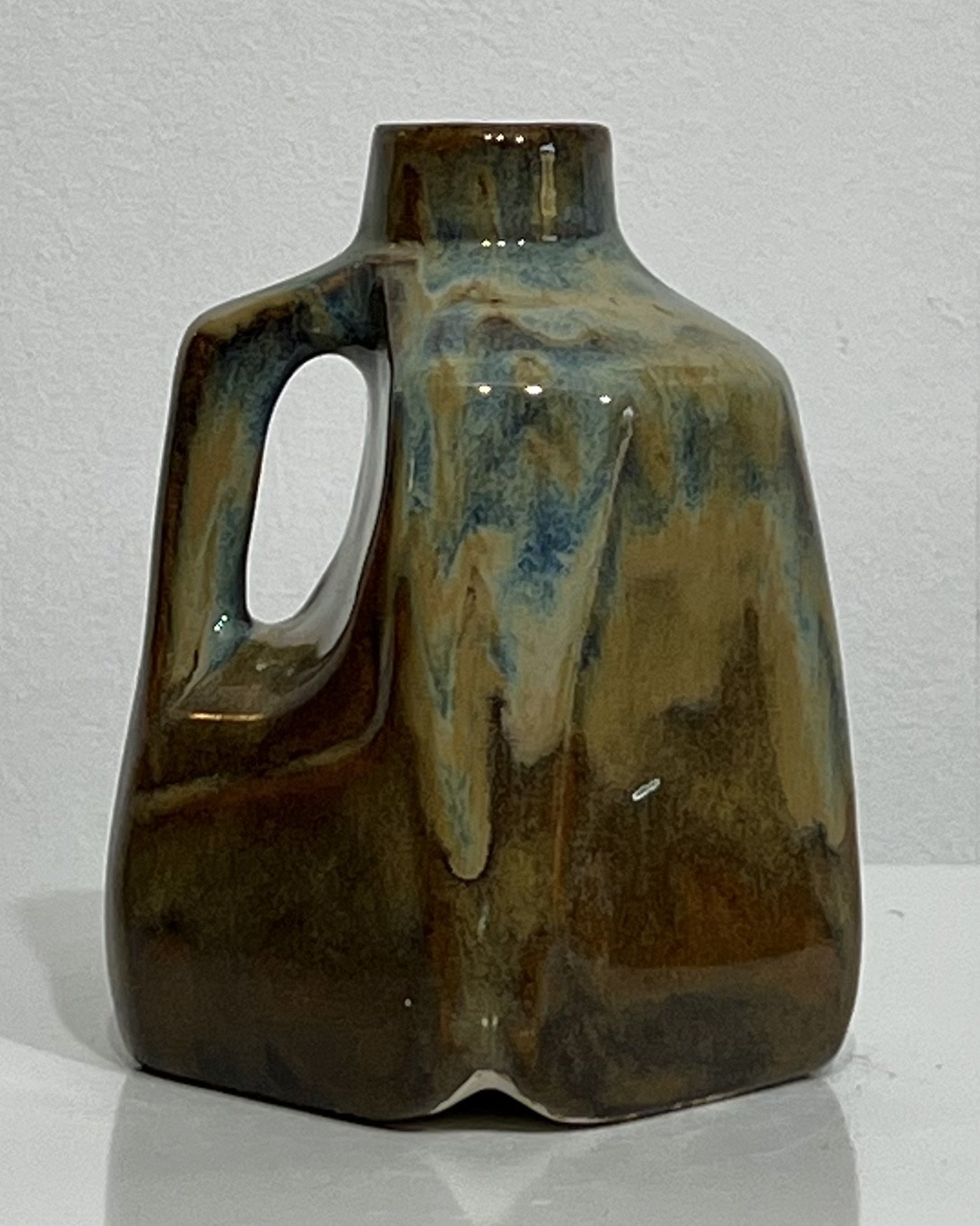Back view of one-of-a-kind porcelain milk jug with Iron Lustre and Blue Rutile glaze variations