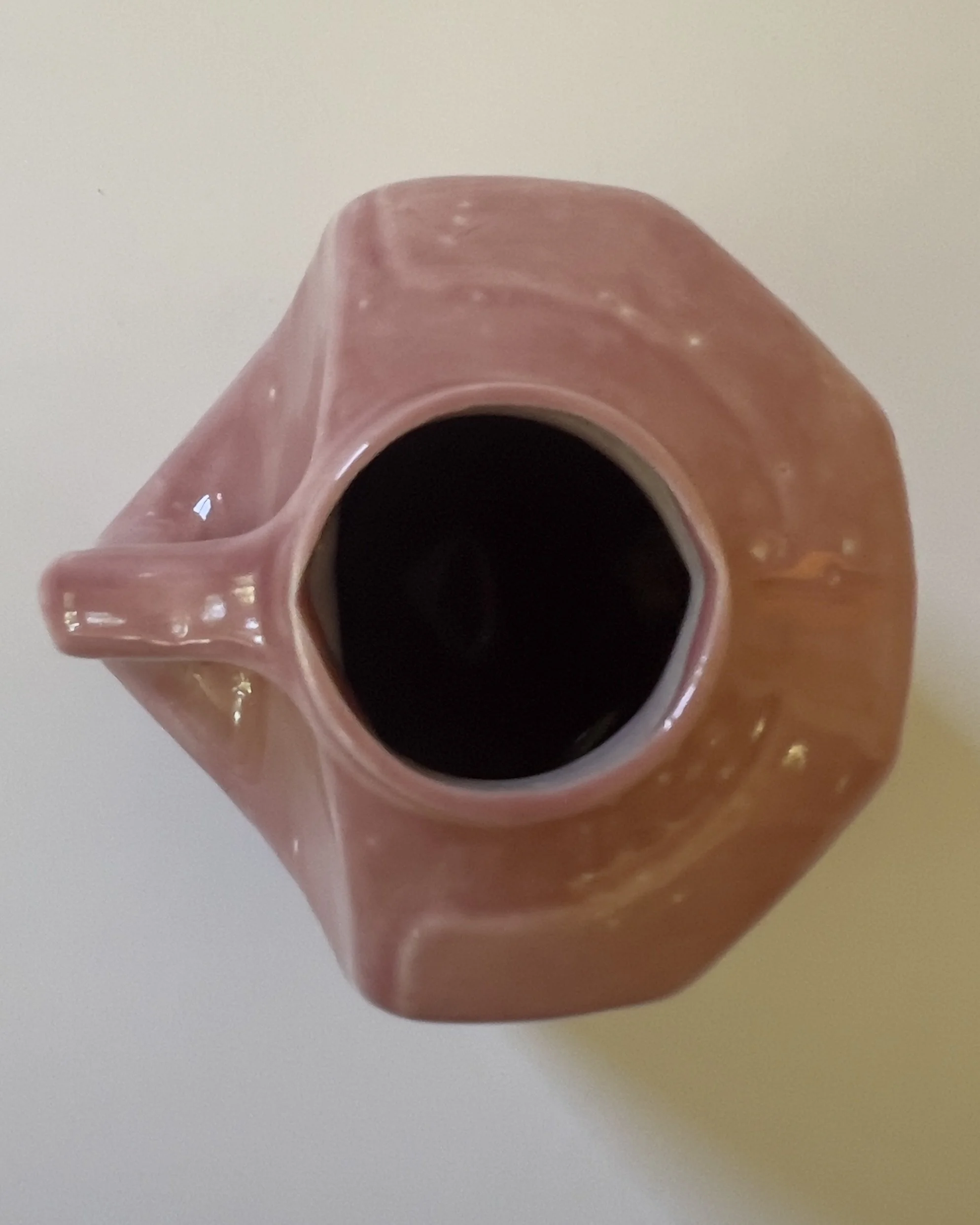 Top view of ceramic milk jug vessel with narrow circular opening