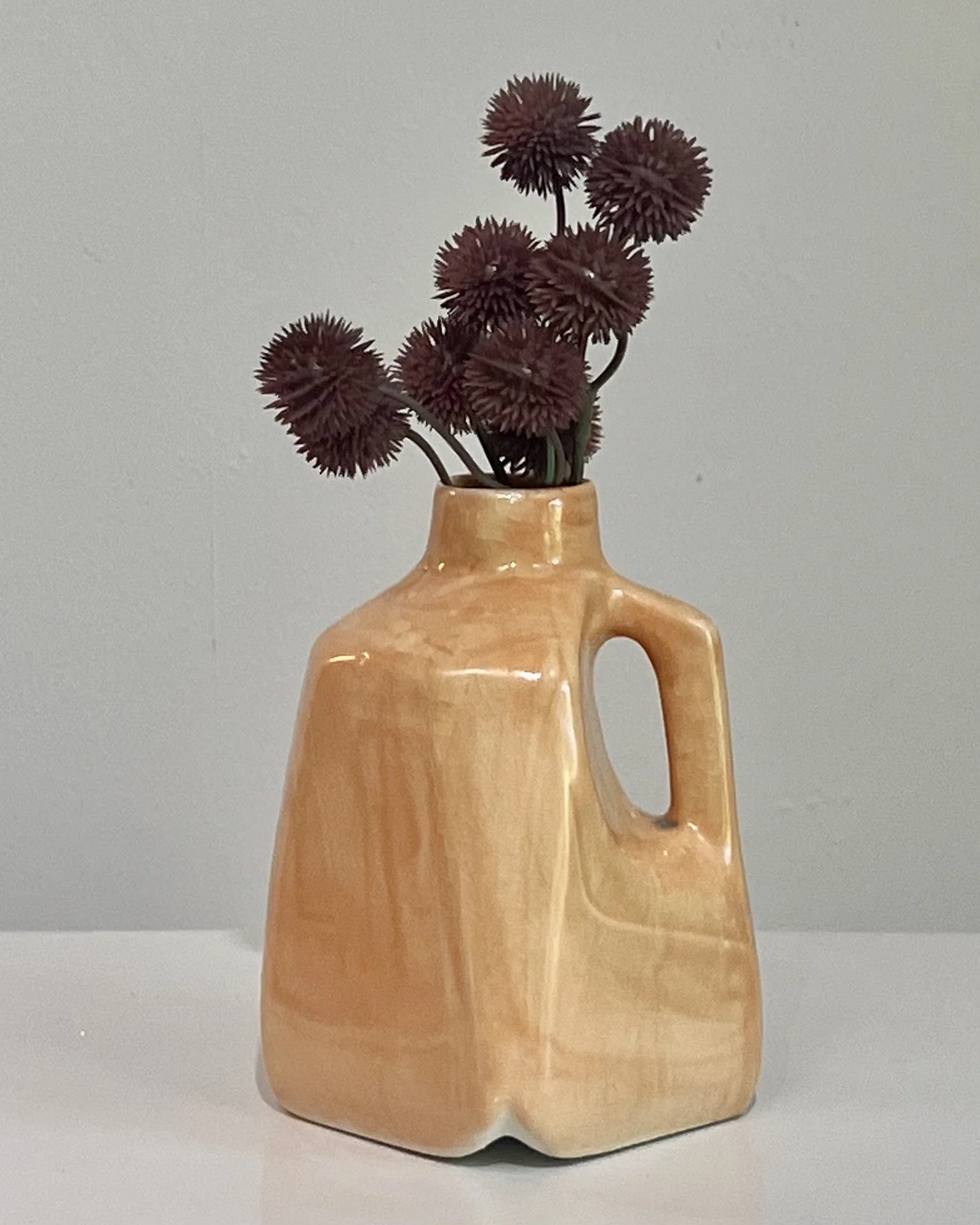 Milk Jug 26.53 in Snow Drift over Tangelo porcelain glaze with flowers