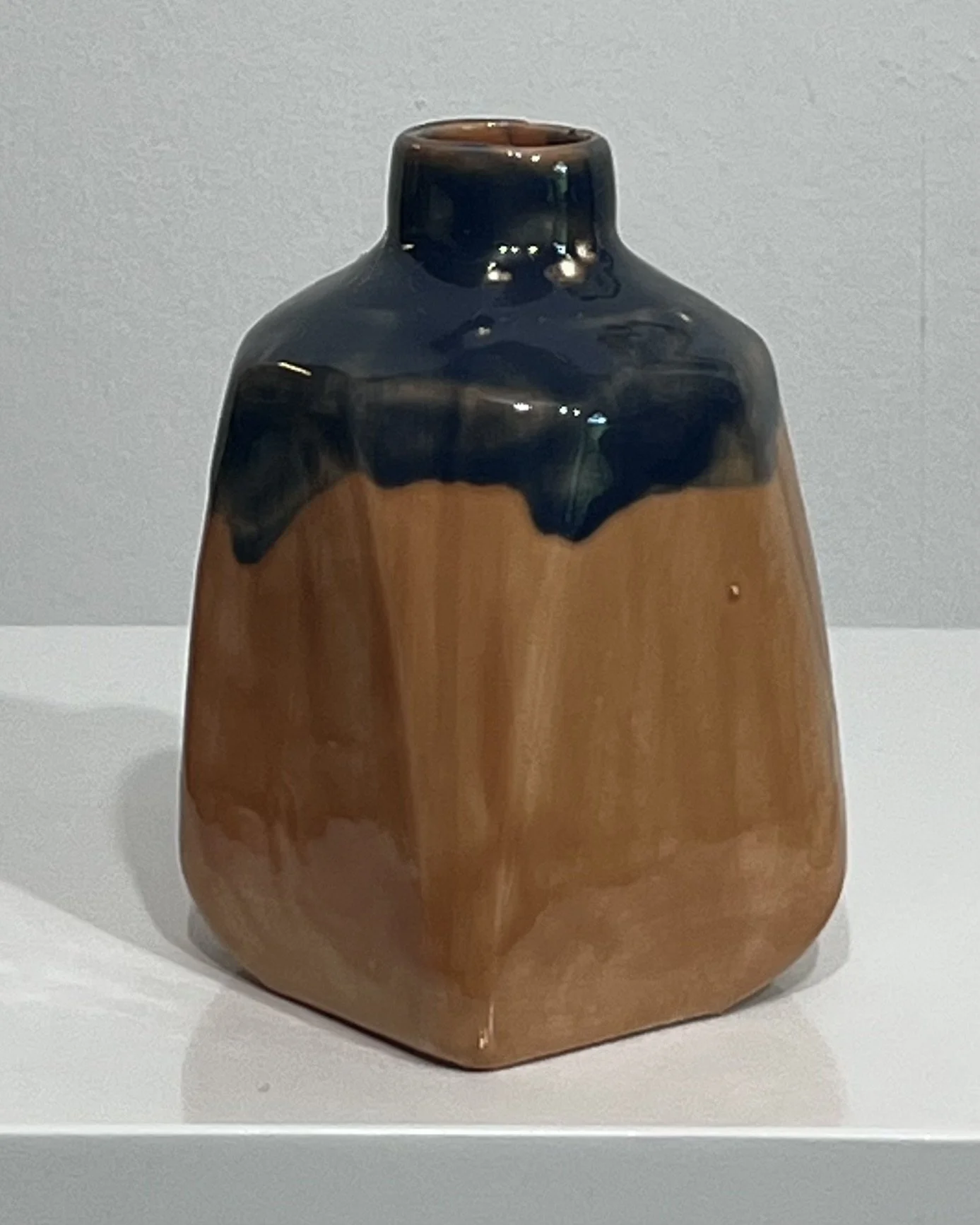 Opposite angle of porcelain milk jug vase showing Deep Sea glaze on handle