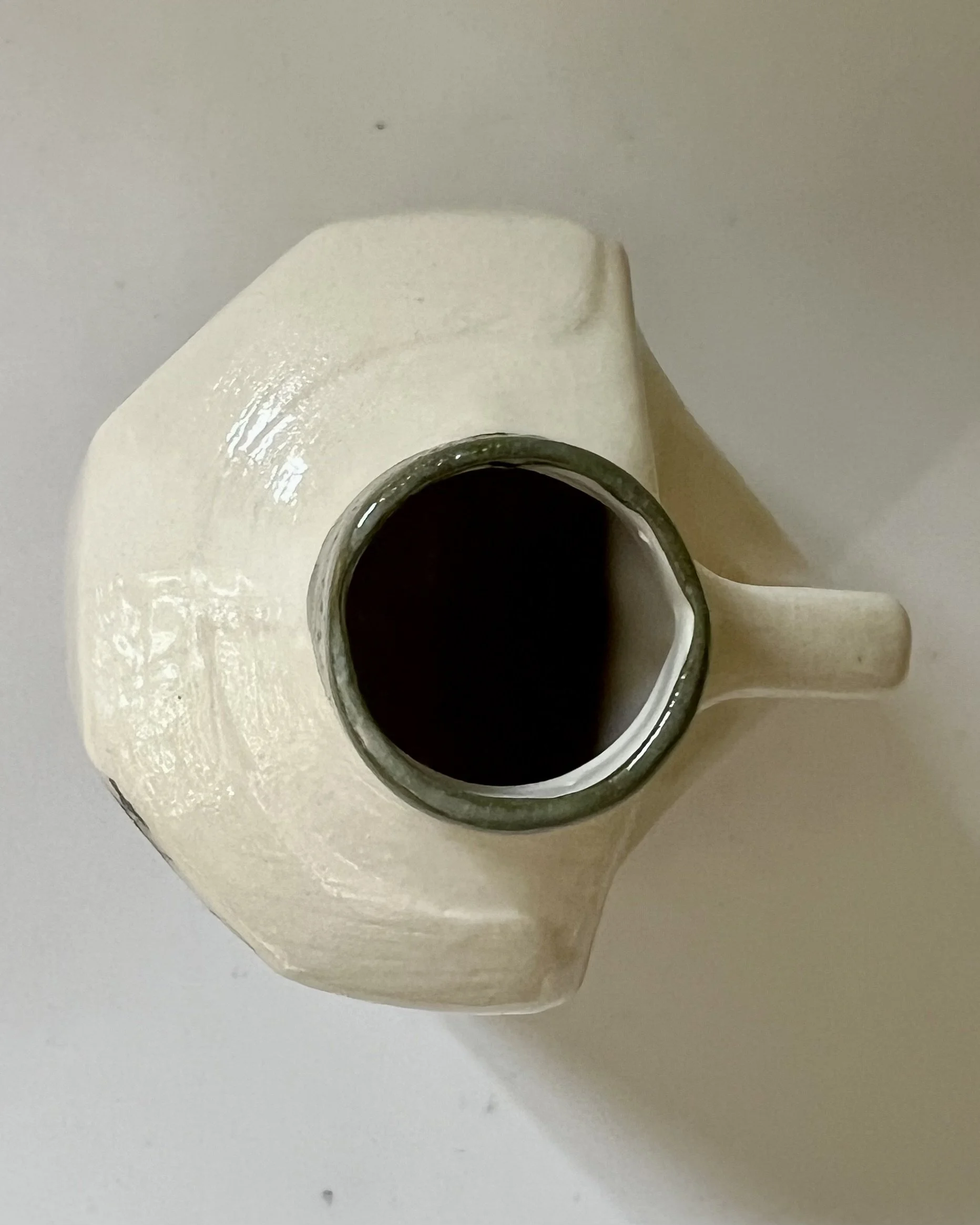 Top view of Verdant Sketch handmade porcelain milk jug vase showing the opening and glazed interior.