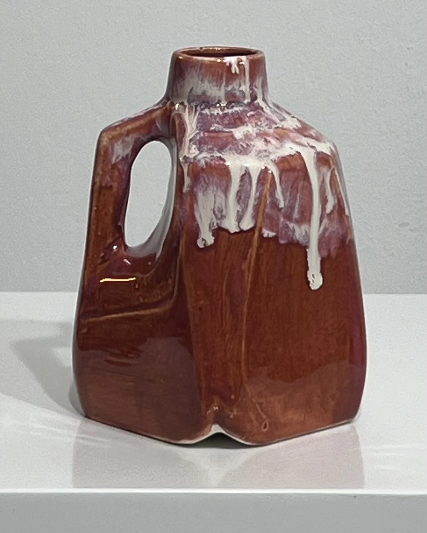 Back view of one-of-a-kind porcelain milk jug with Chun Plum and Light Flux glazes