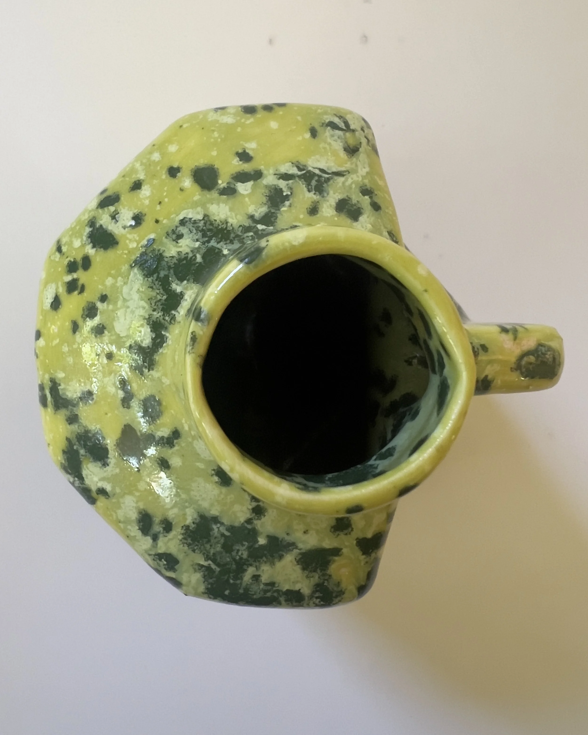 Top view of handmade ceramic vessel showing opening and glaze surface