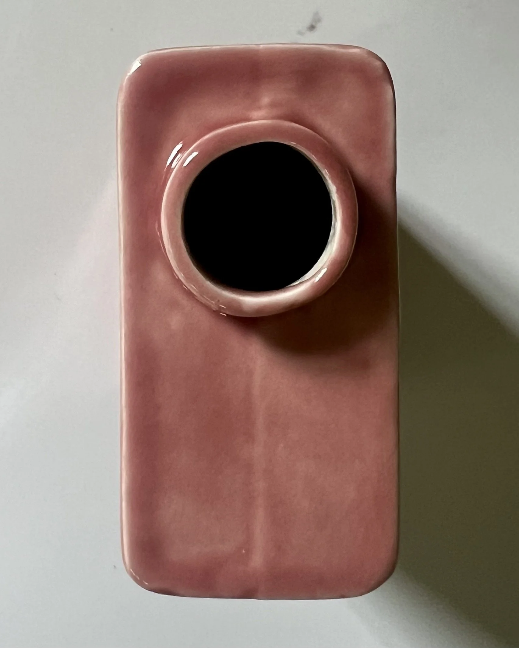 Top view of porcelain carton vase showing circular opening and glossy Weeping Plum glaze.