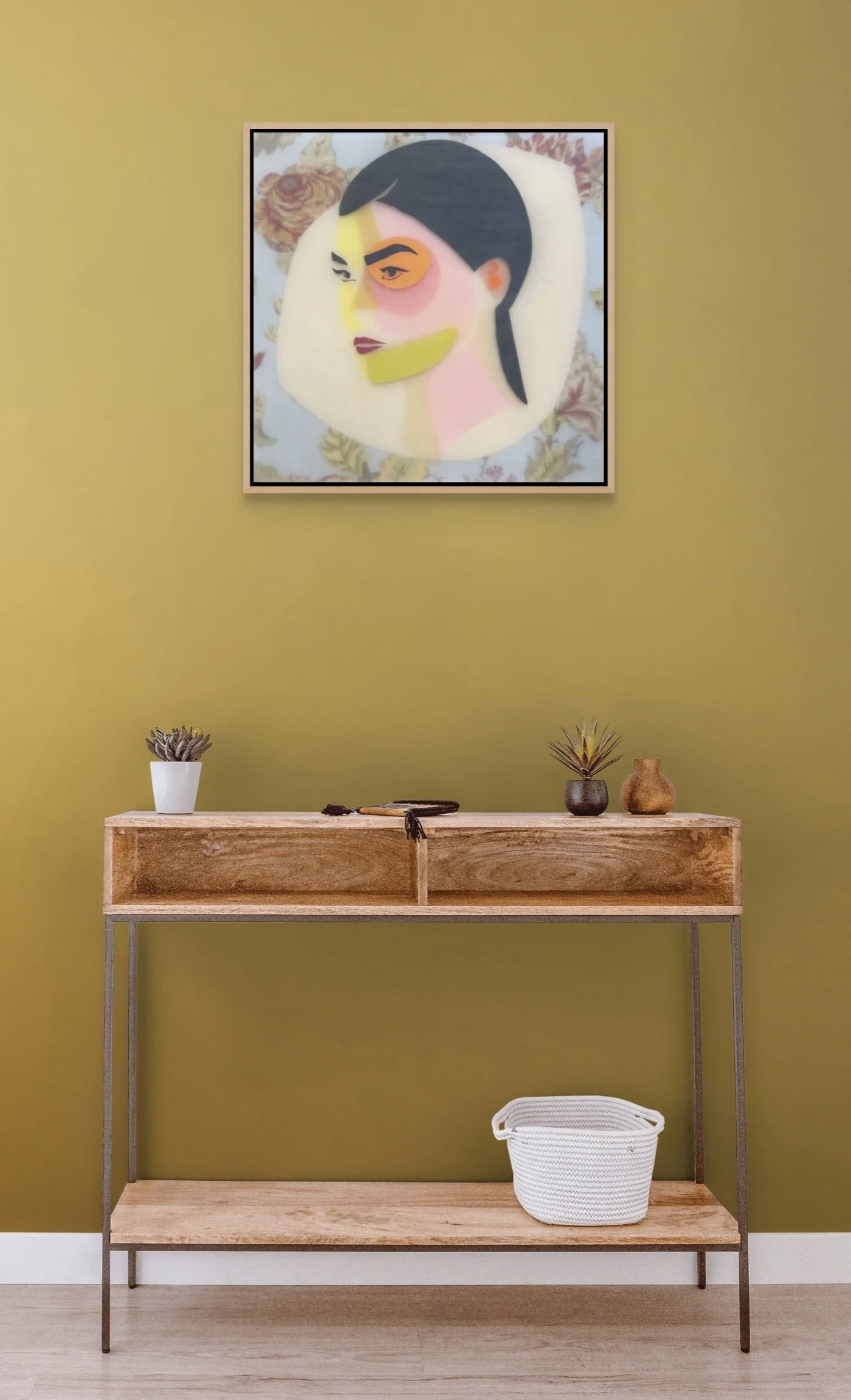 Adeline displayed above a wooden console, illustrating the scale of the colorful mixed media artwork in a room