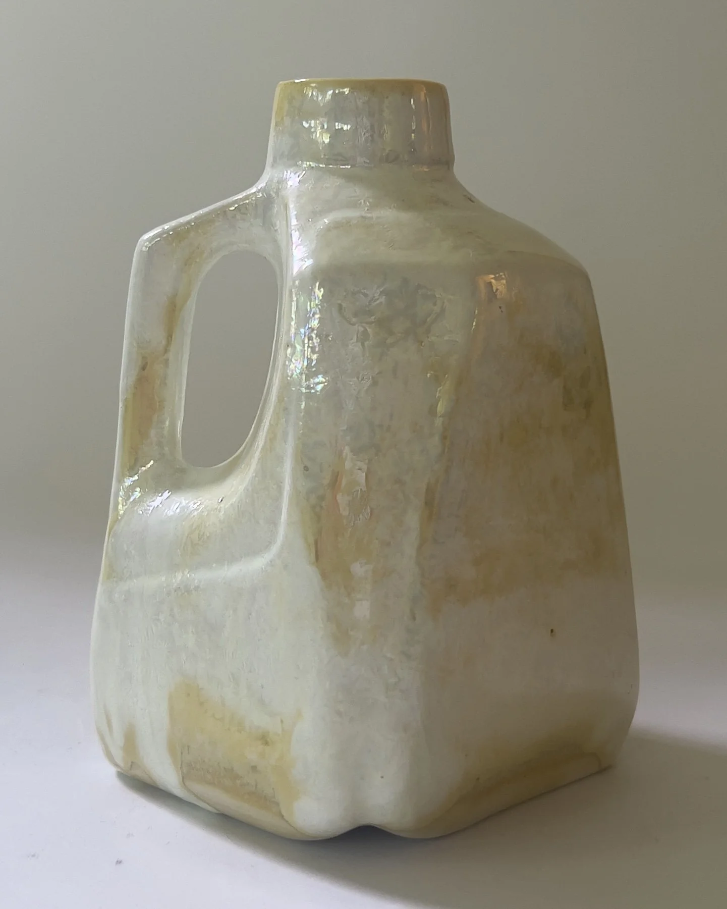 Contemporary ceramic milk jug vase with pearlescent glaze and sculptural geometric form